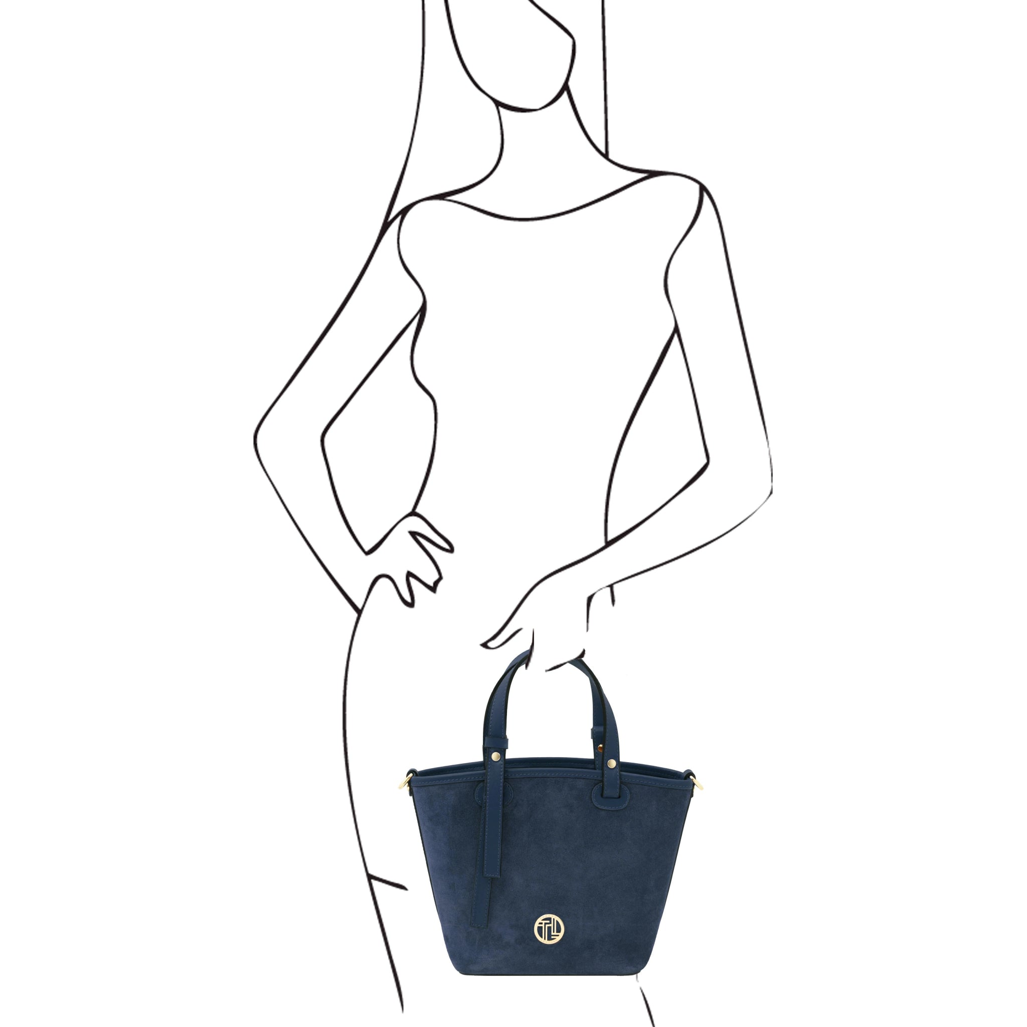 Black and white sketch of a woman holding Glacette Suede Bucket bag in Dark Blue