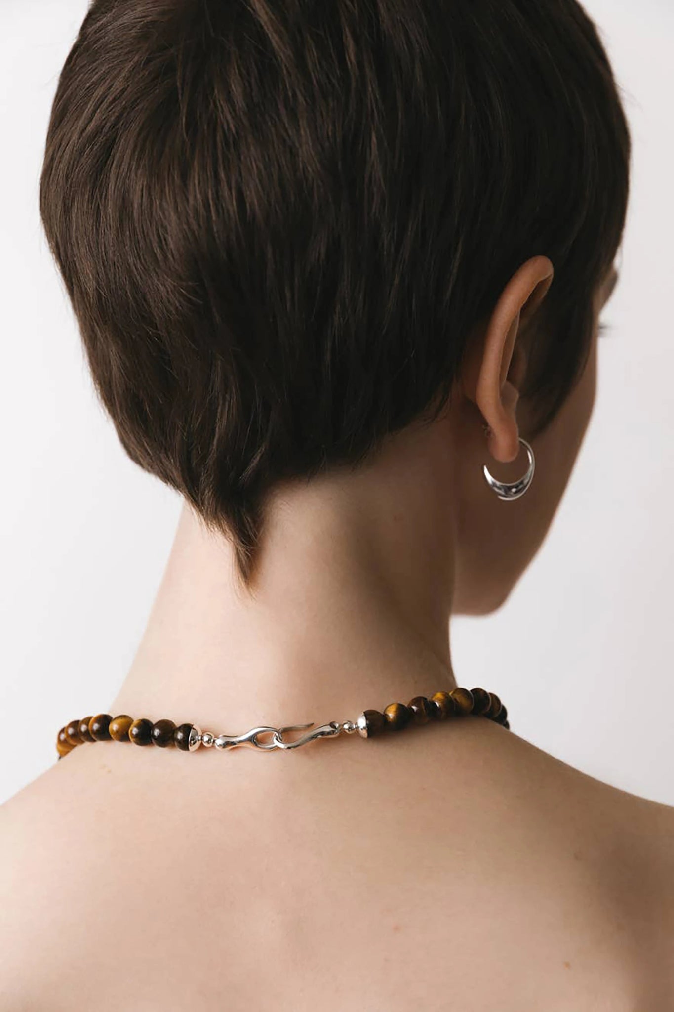 Inez Sterling Silver Hoop Earrings on a female model 