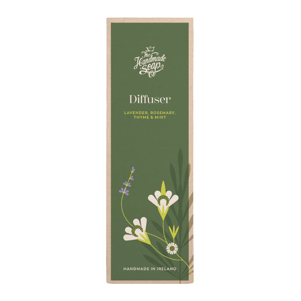 Green diffuser packaging with floral design and text on a white background