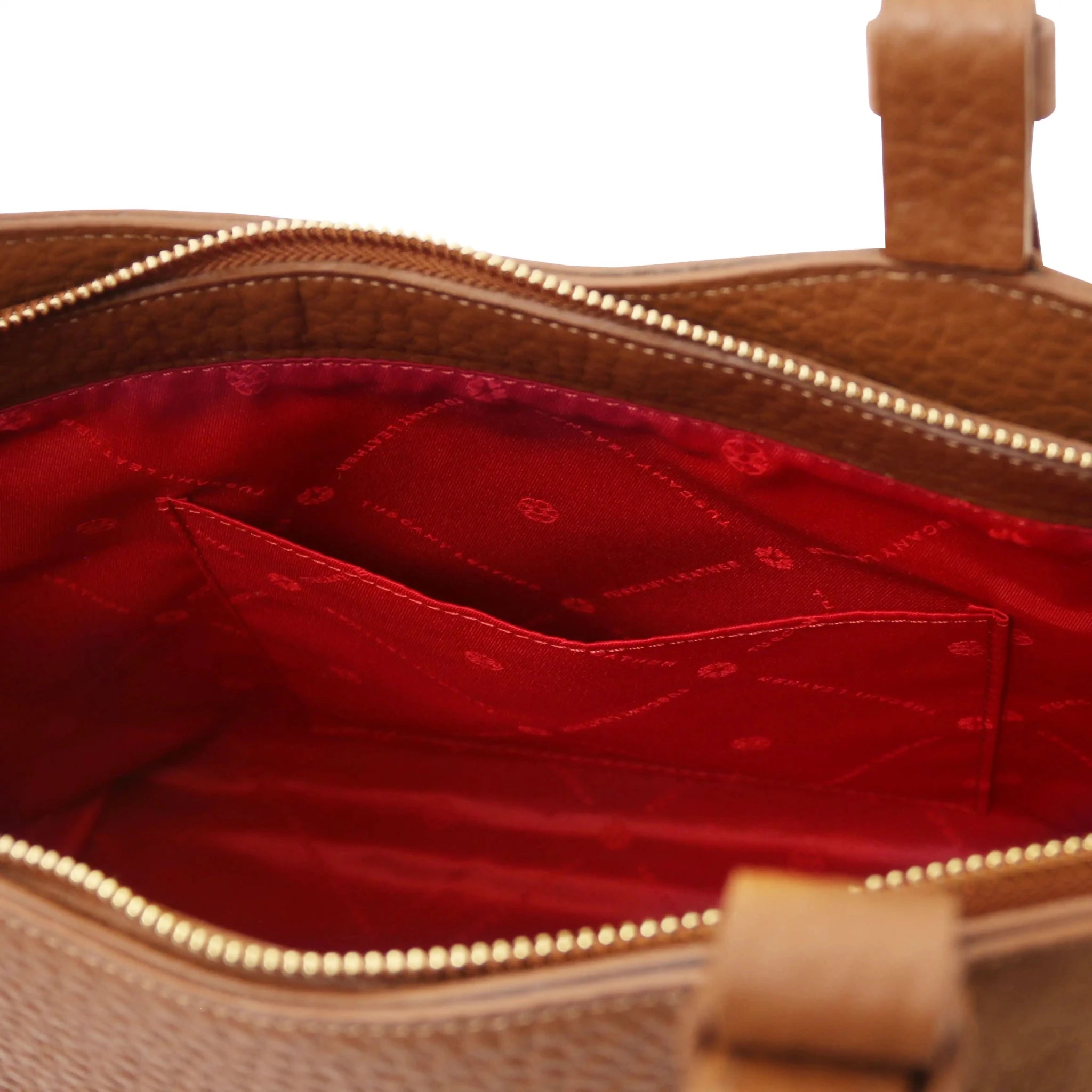 Interior open pocket view Libra Leather Shoulder Bag in cognac with red lining
