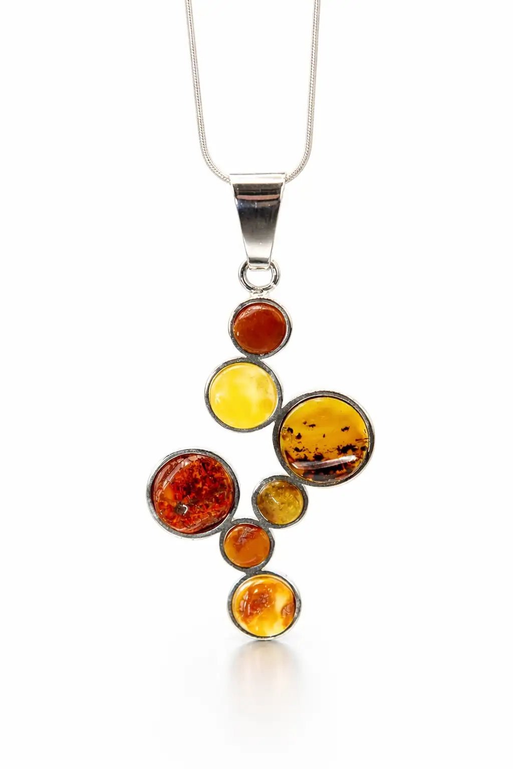Multicolored amber pendant on a silver chain against a white background
