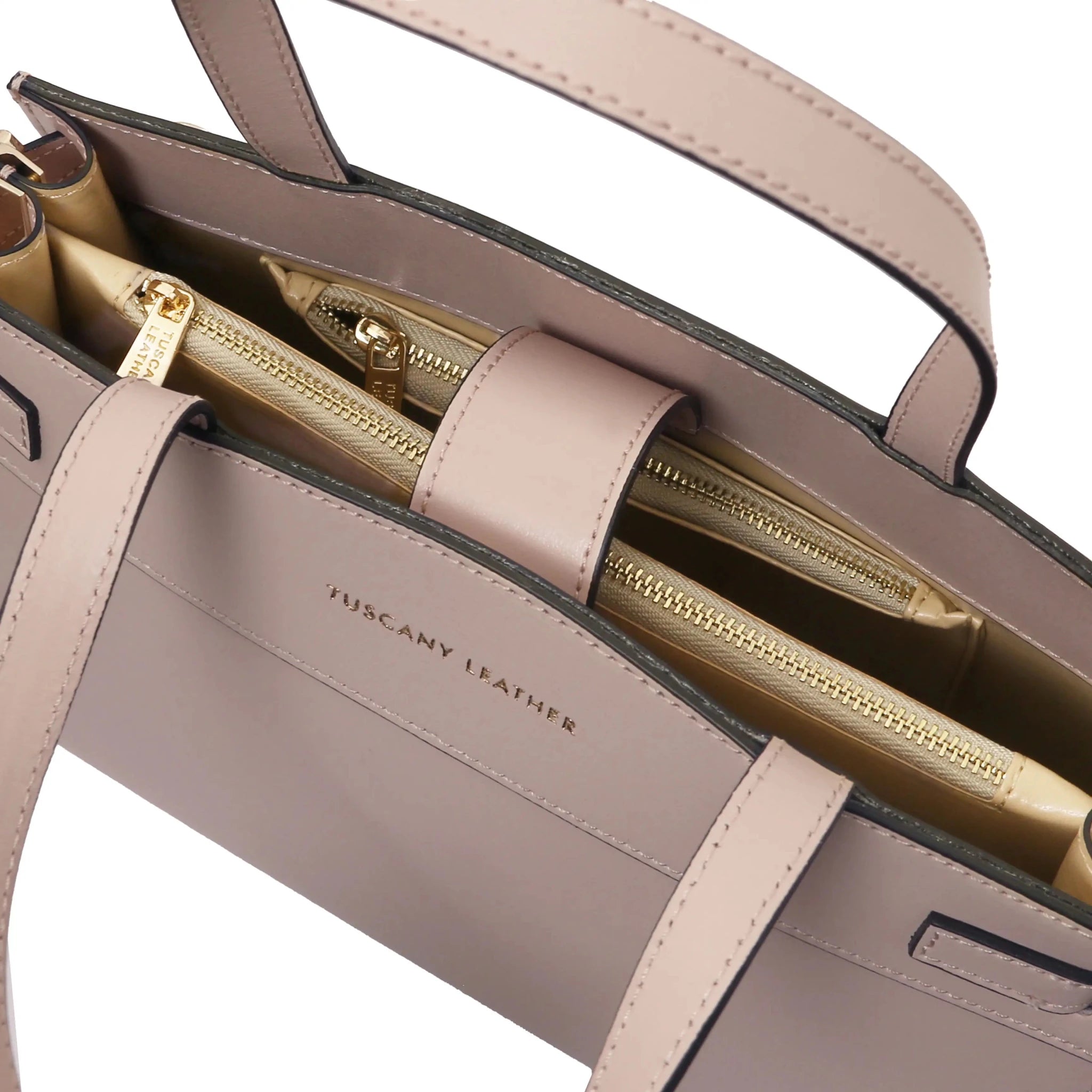 Interior zip pockets and magnetic closure view Musa Italian Smooth Leather Tote Bag in nude with beige lining