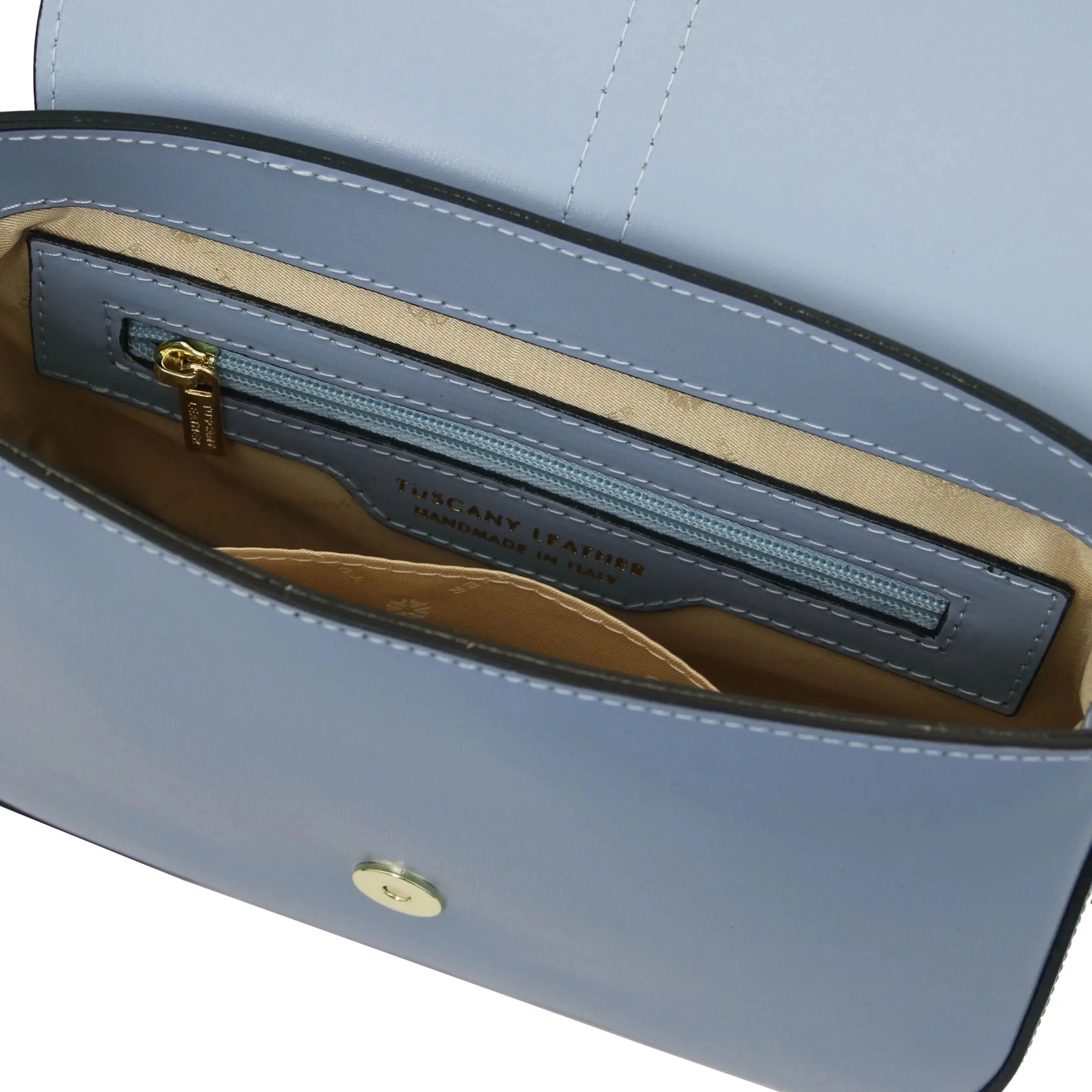 Interior Zip Pocket View Nausica Leather Shoulder Bag in Light Blue showing beige lining