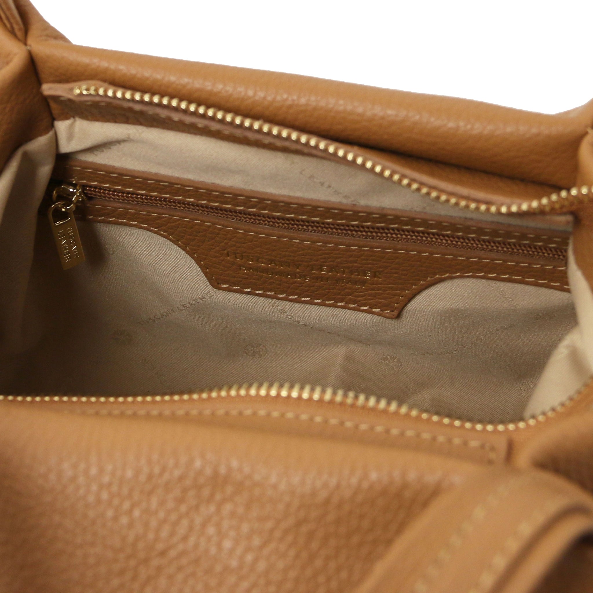 Interior zip pocket view Nora Soft Italian Leather Shoulder Bag in Caramel showing main zippered closure