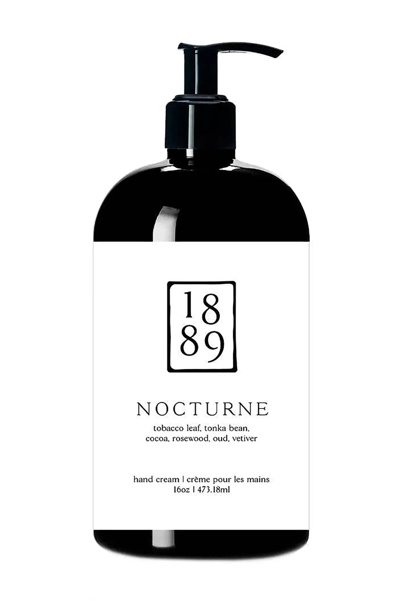 Black hand cream bottle with '1889 Nocturne' label on a white background
