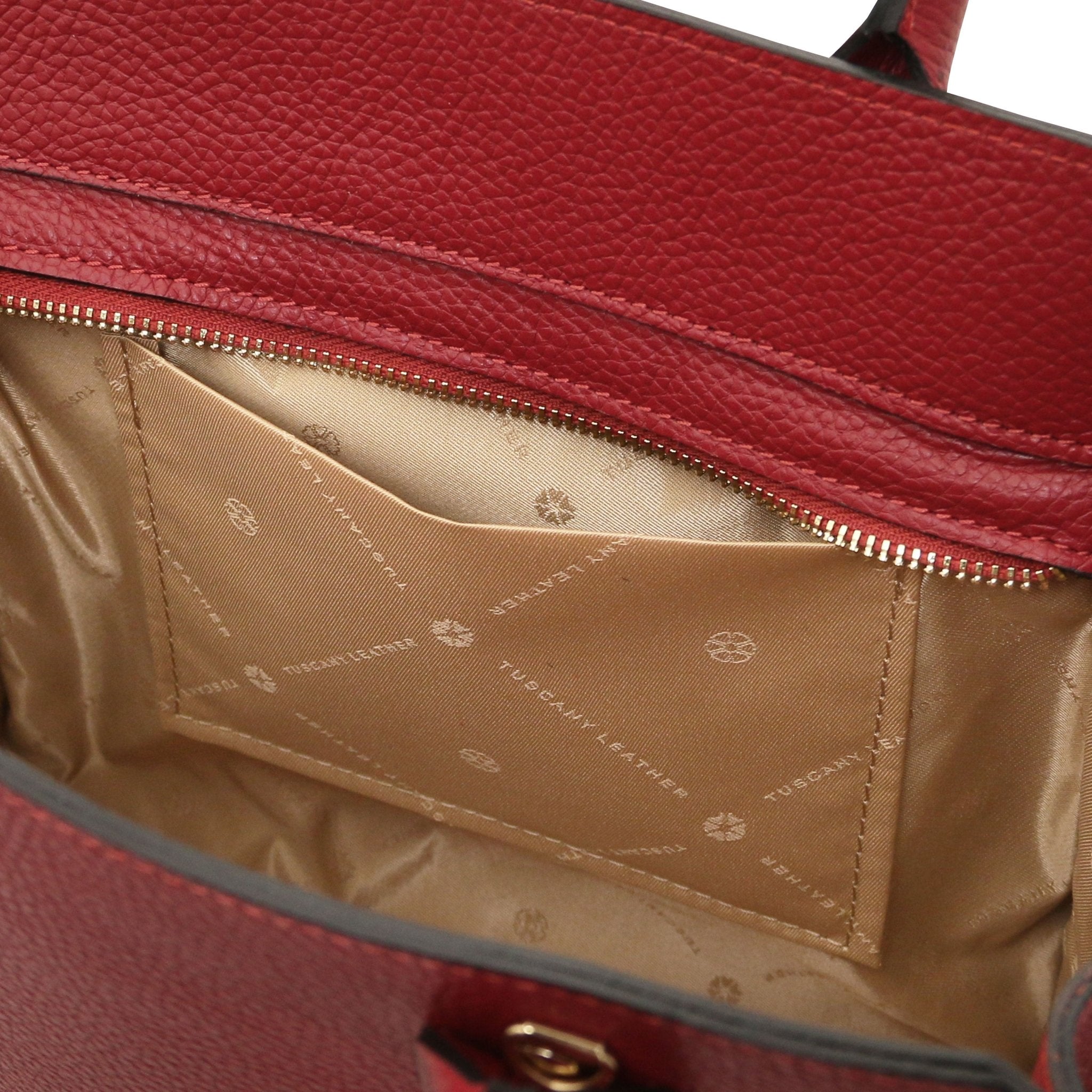 Interior zip pocket view Origami Italian Pebbled Leather Tote in red with beige lining