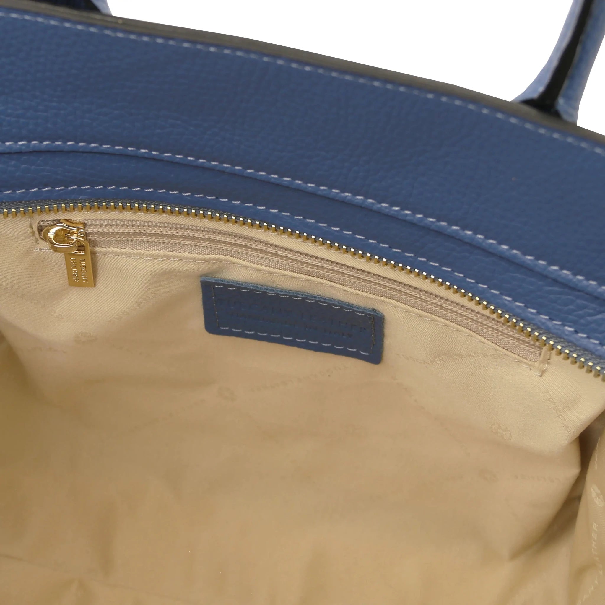 Interior zip pocket view Origami Italian Pebbled Leather Tote in denim with beige lining