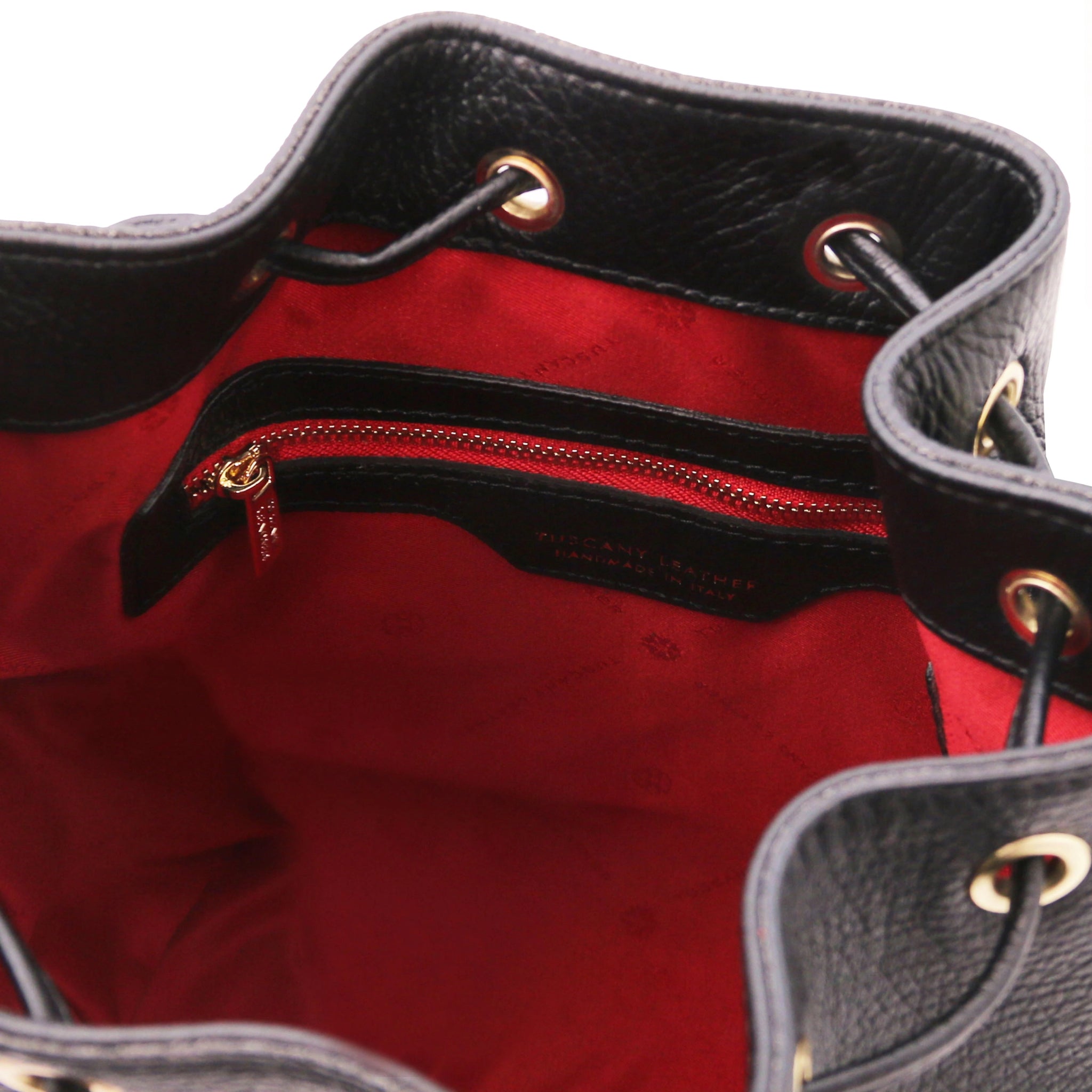 Interior view Panerea Leather Bucket Bag in Black showing interior zip pocket, drawstring with grommets and red lining