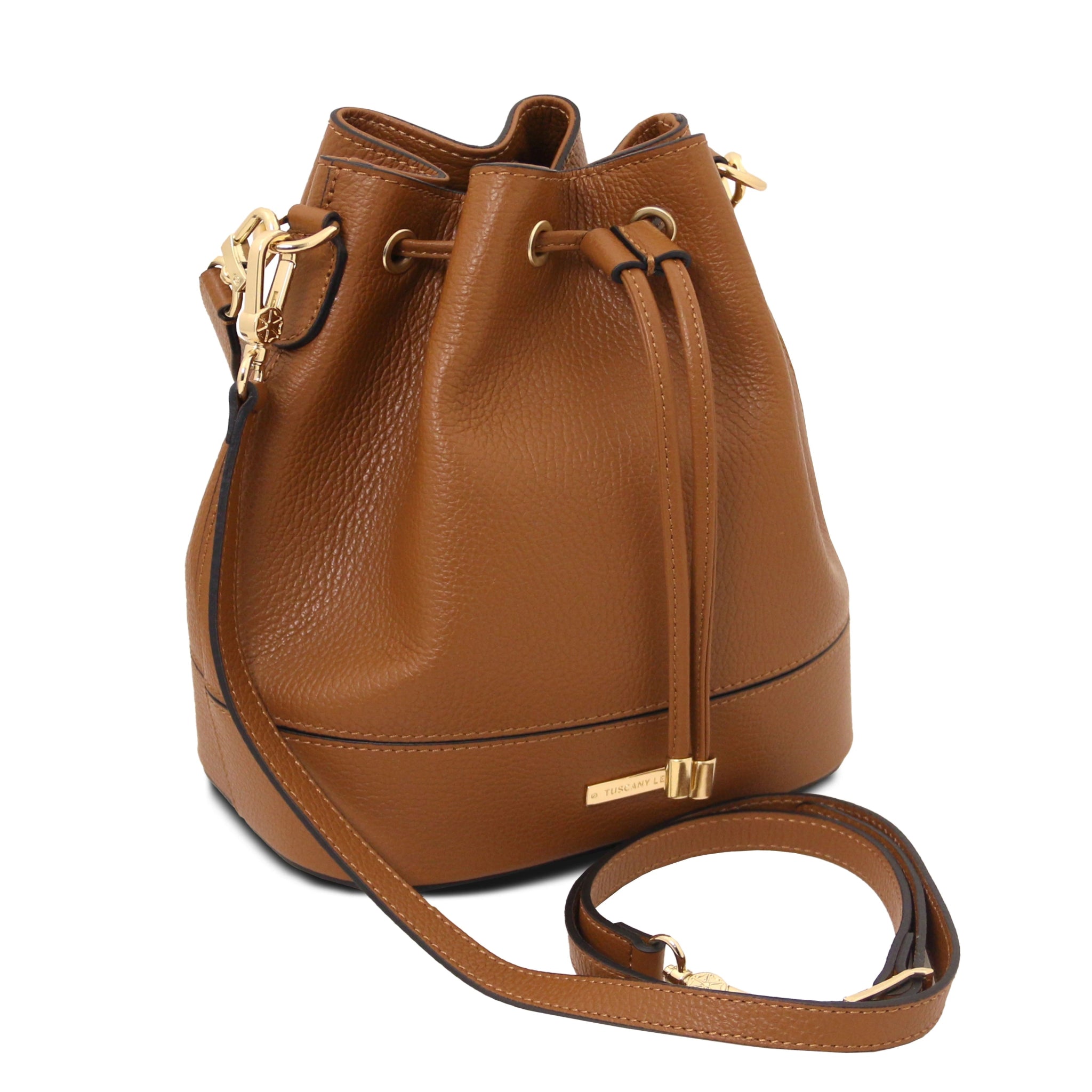 Front view Panerea Leather Bucket Bag in Cognac showing drawstring with golden metal pulls, leather with golden metal handle and detachable shoulder strap