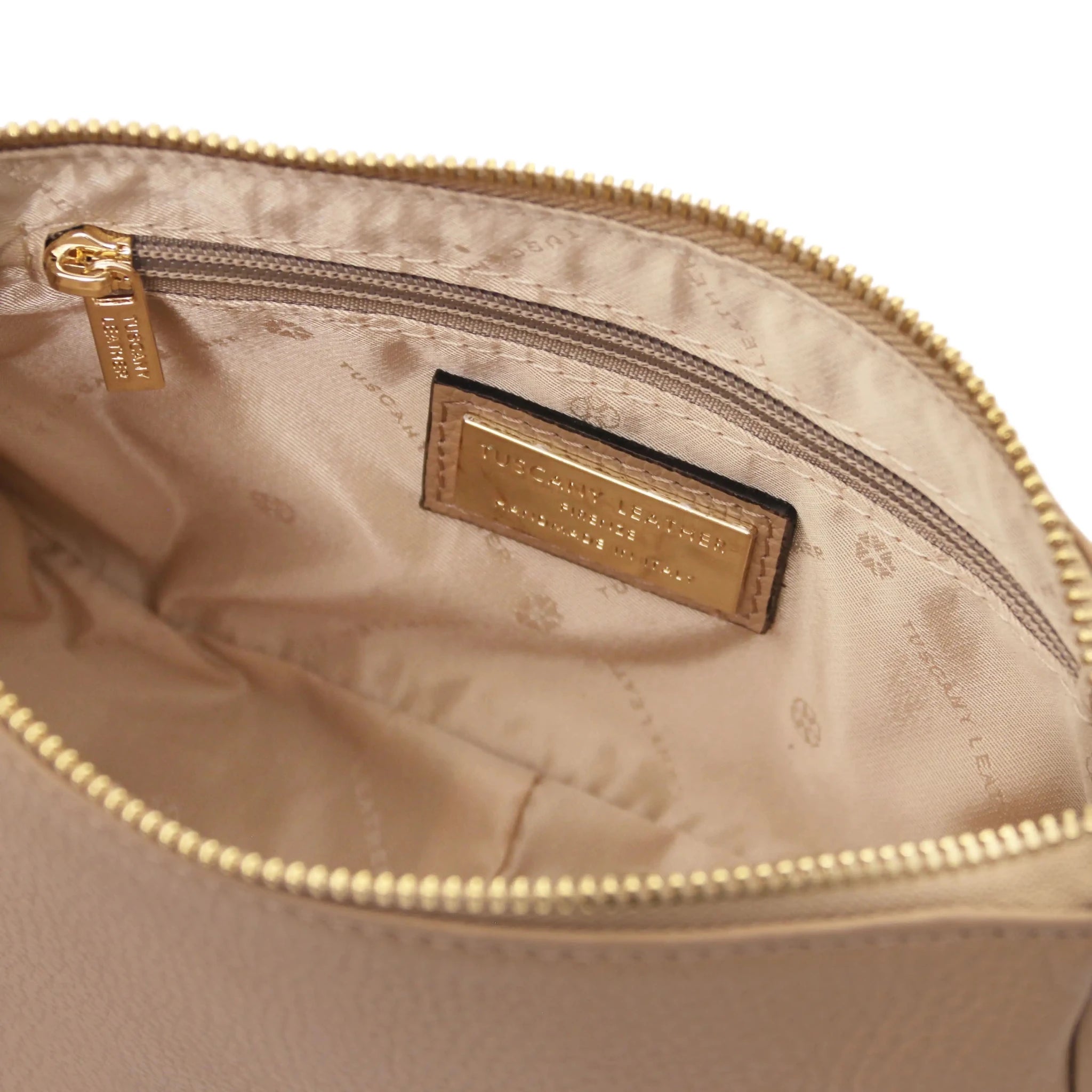Interior zip pocket view Parfait Leather Clutch in caramel with beige lining on white background