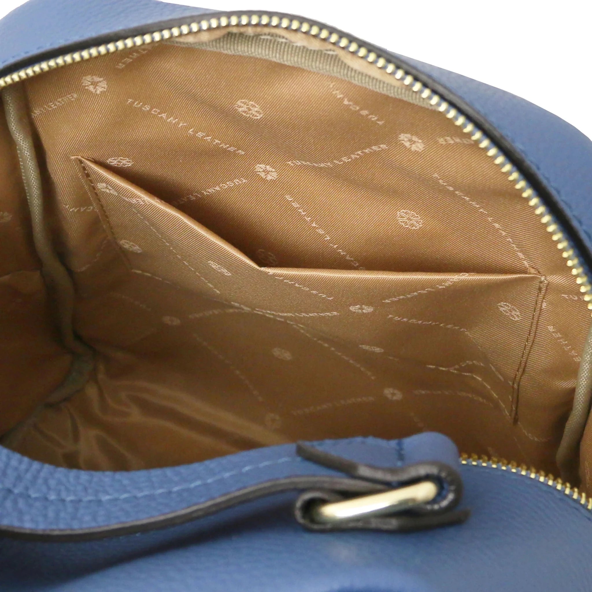 Interior open pocket view Prisma Leather Backpack in denim with beige lining