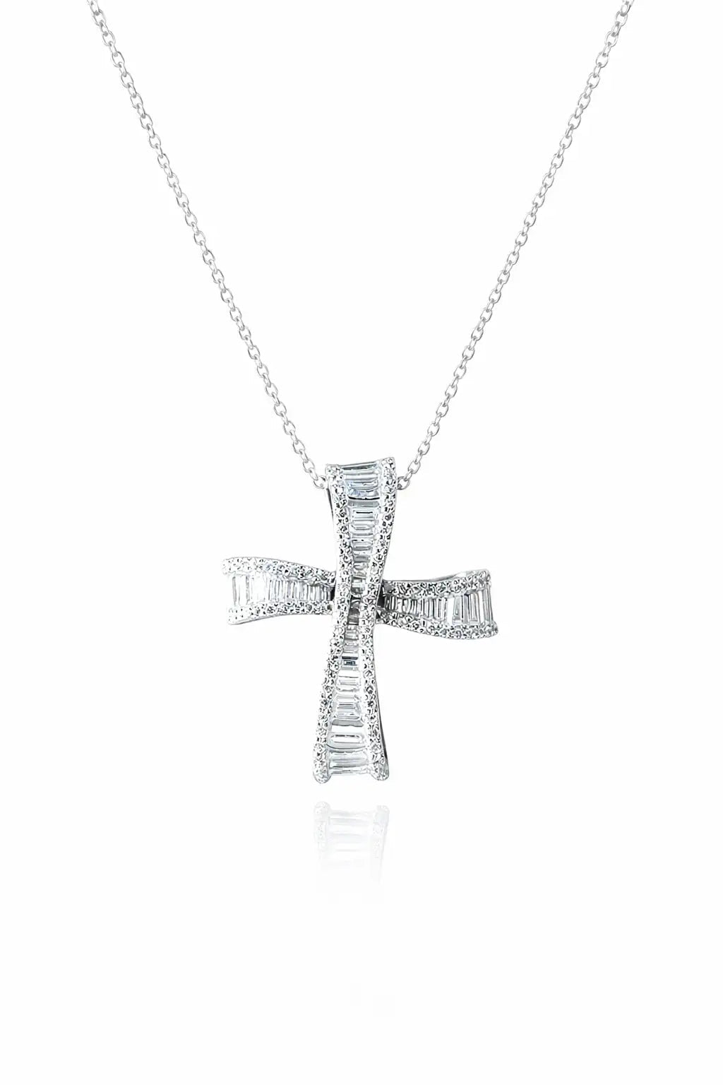 Silver cross pendant necklace on a white background