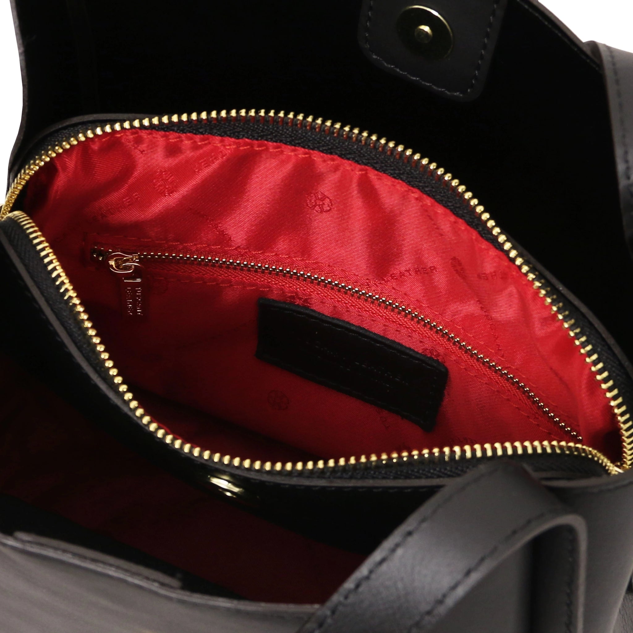 Interior zip pocket view Soave Soft Leather Handbag in Black with red lining