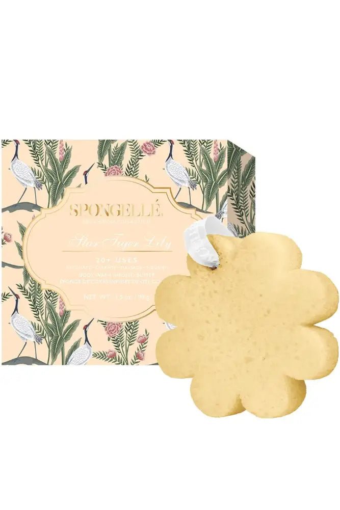 Flower-shaped yellow sponge with floral packaging on a white background