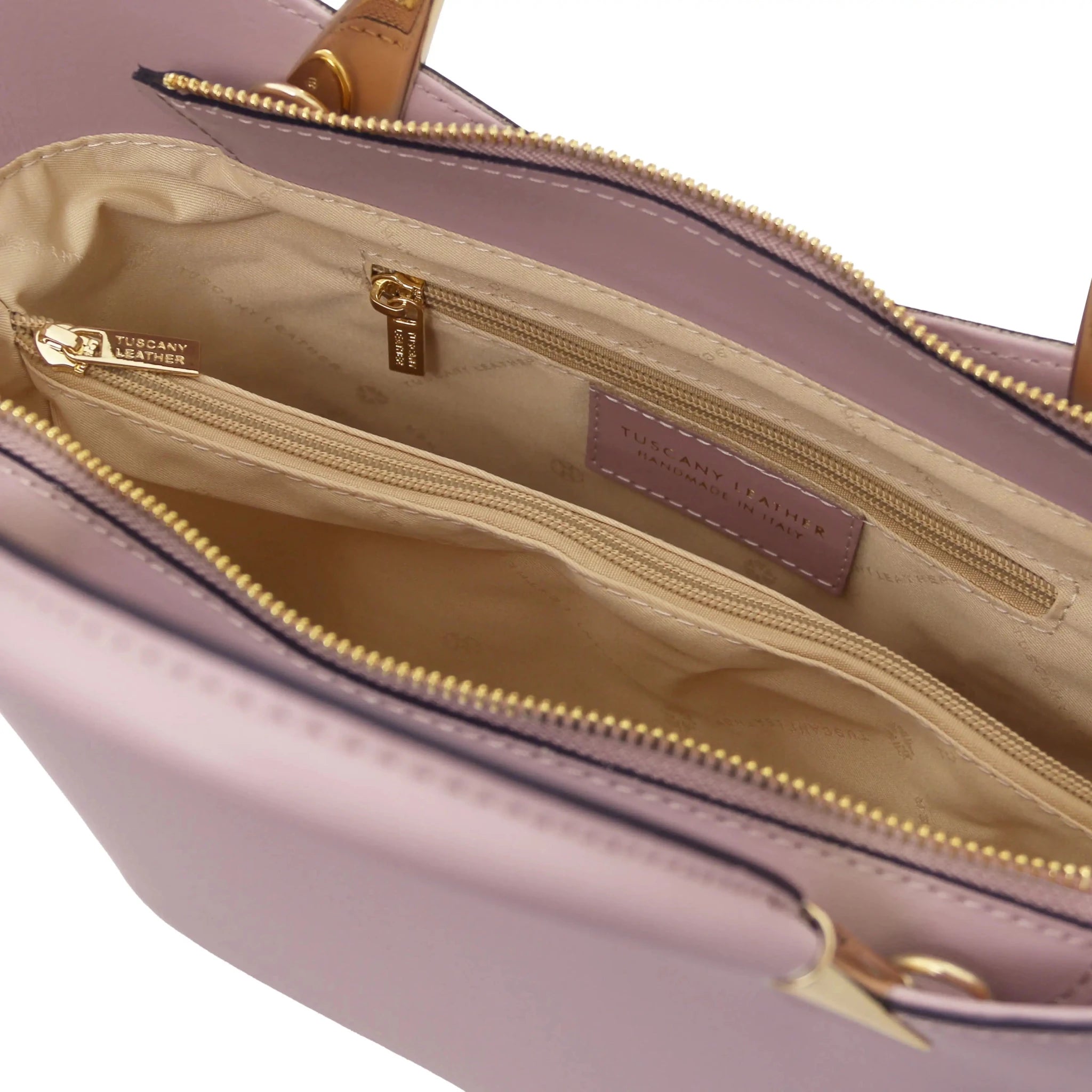 TL Bag in Lilac interior view showing centered zippered compartment, beige lining and zippered pocket