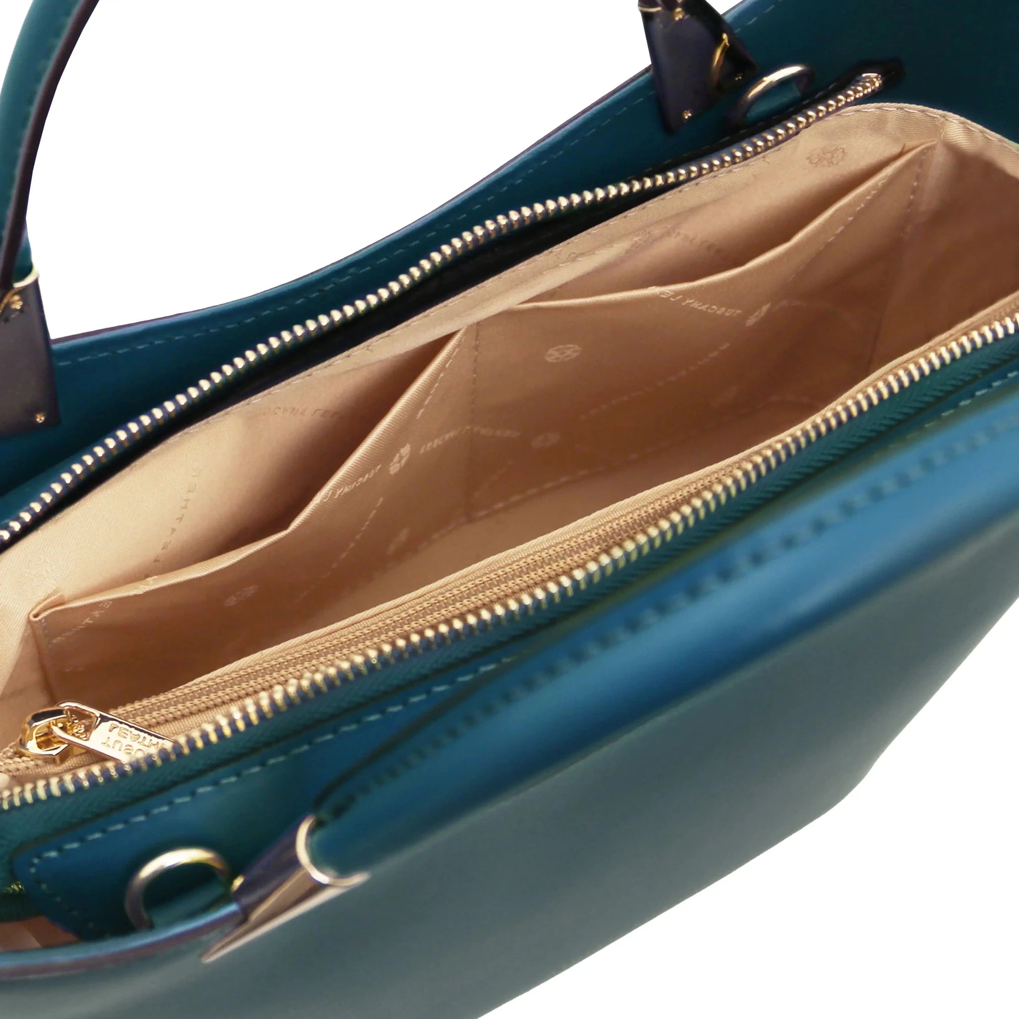 TL Bag  in Teal interior view showing centered zippered, beige lining, compartment and open pockets