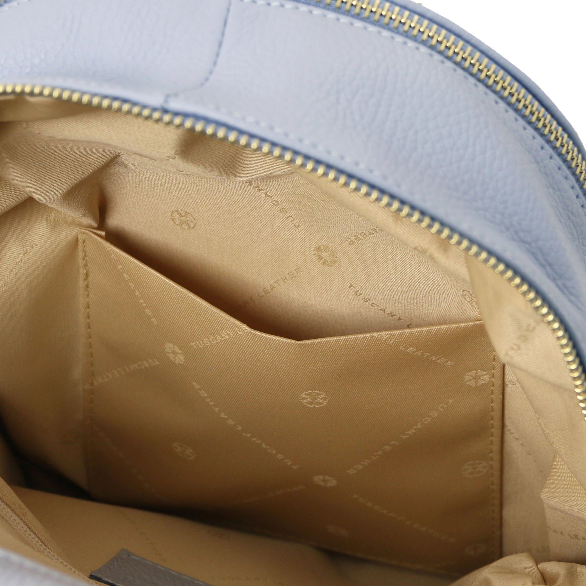 Interior zipped pocket view TL Bag Italian Soft Leather Zip Backpack in light blue showing beige lining