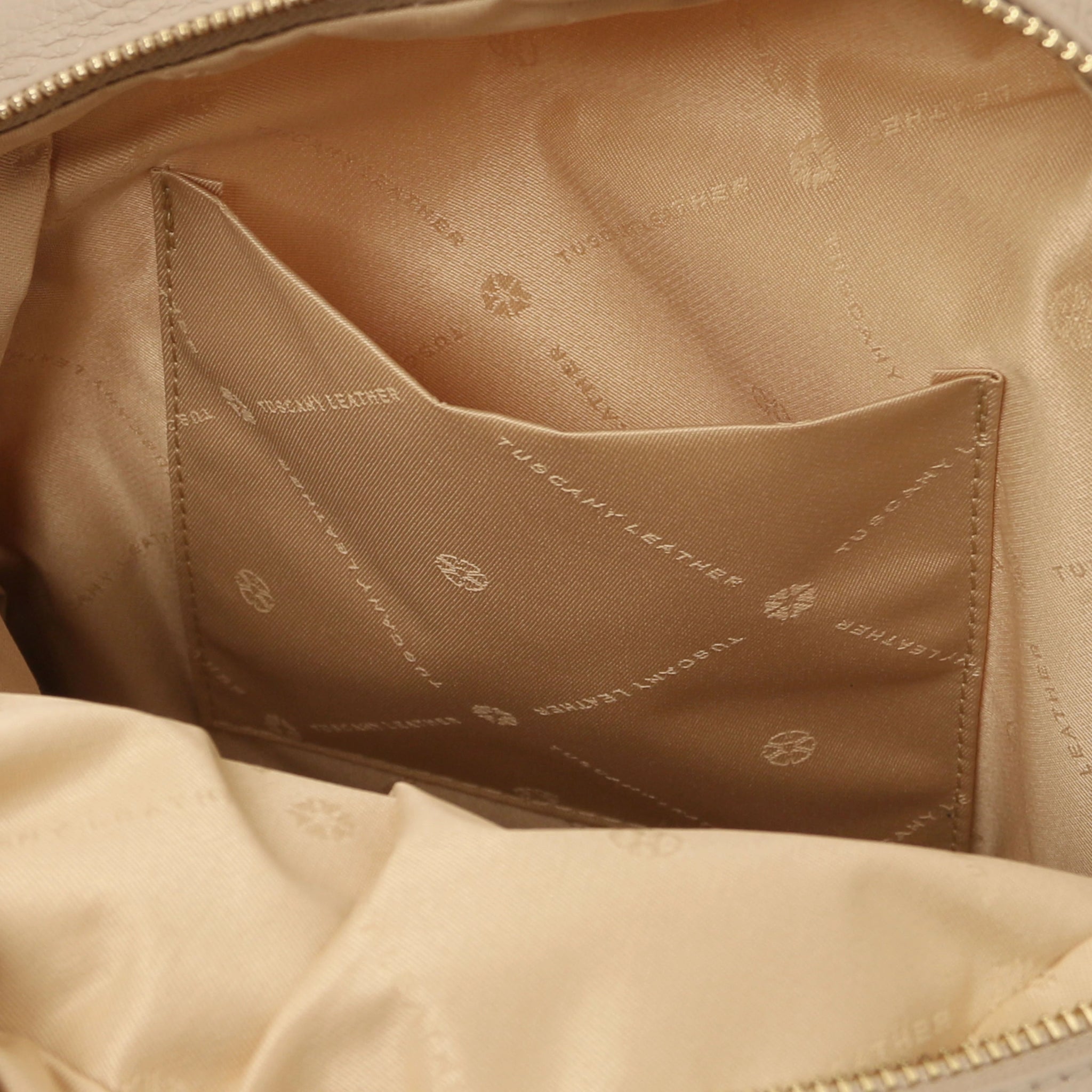 Interior open pocket view TL Bag Italian Soft Leather Zip Backpack in light. taupe showing beige lining