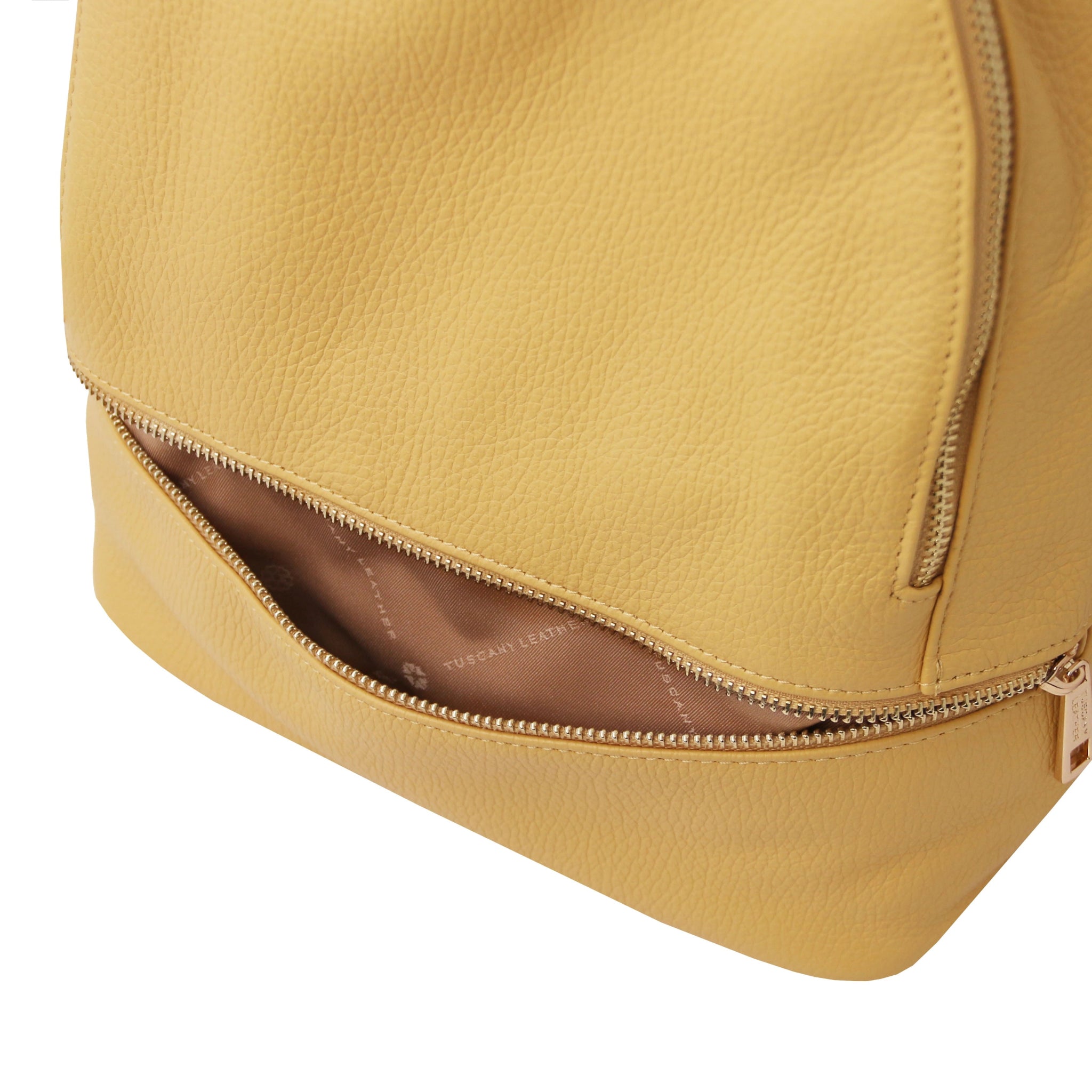 Front zipped pocket interior view TL Bag Italian Soft Leather Zip Backpack in pastel yellow showing beige lining