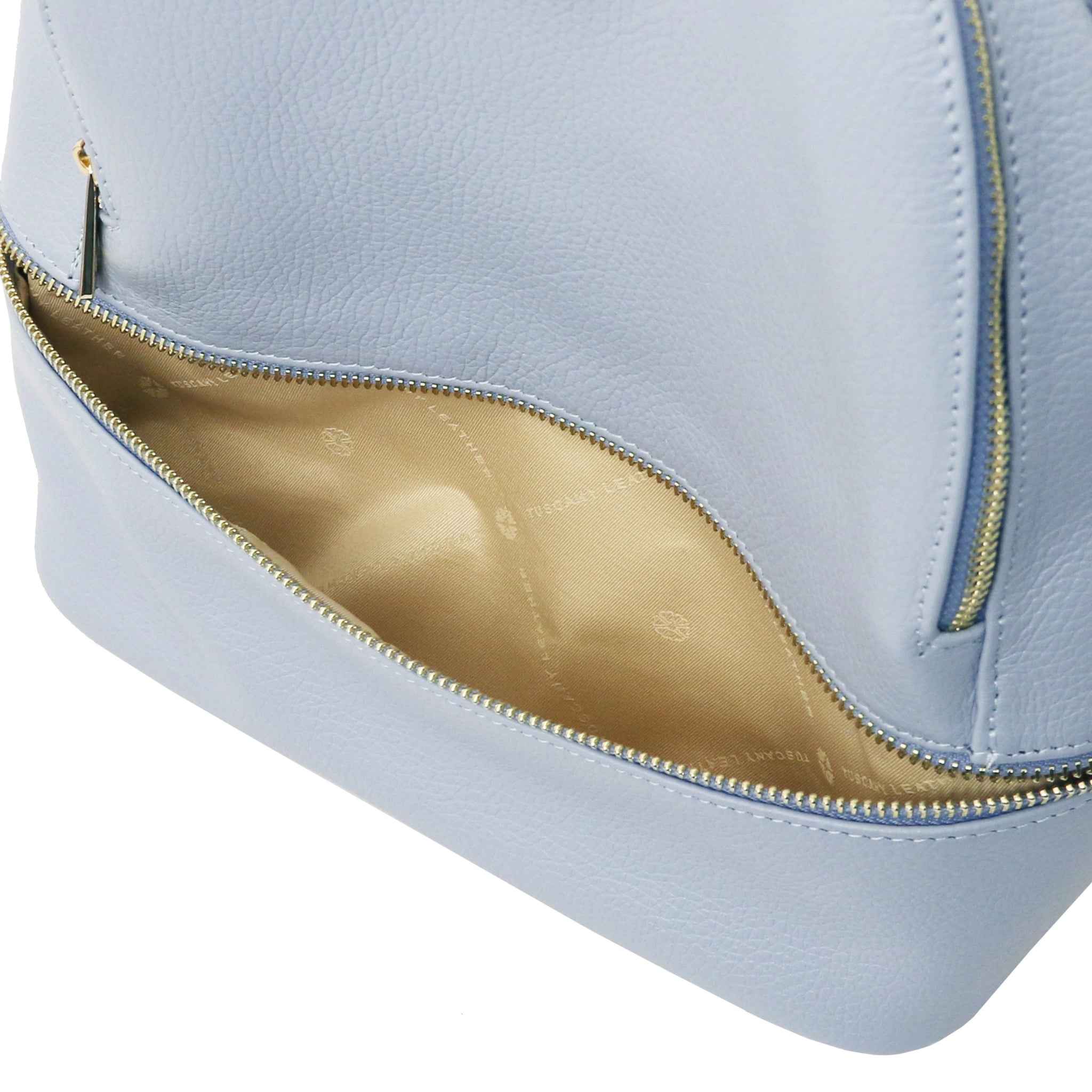 Front zipped pocket interior view TL Bag Italian Soft Leather Zip Backpack in light blue showing beige lining