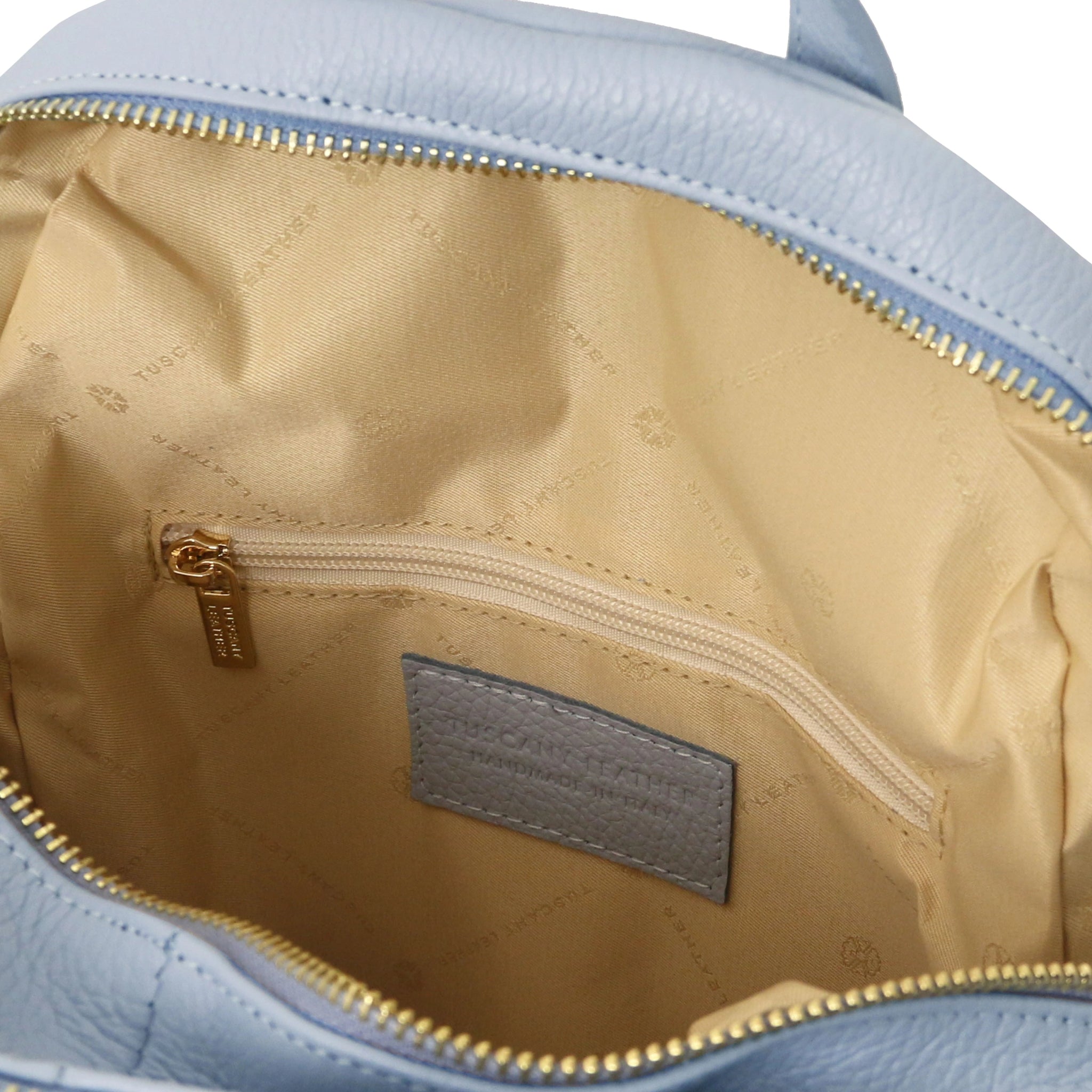 TL Interior open pocket view TL Bag Italian Soft Leather Zip Backpack in light blue showing beige lining