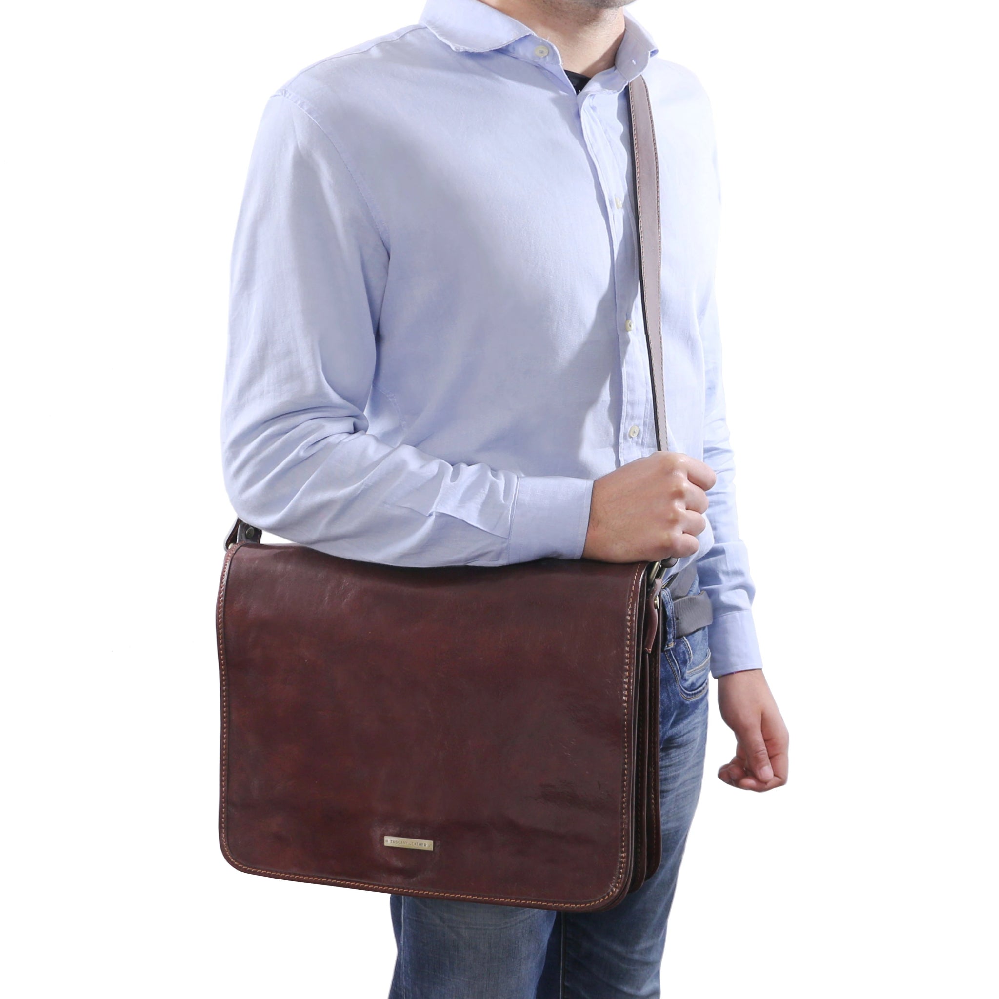 A sketch of a man holding the Large TL Messenger Two Compartment Leather Shoulder Bag in Brown  - L'Atelier Global