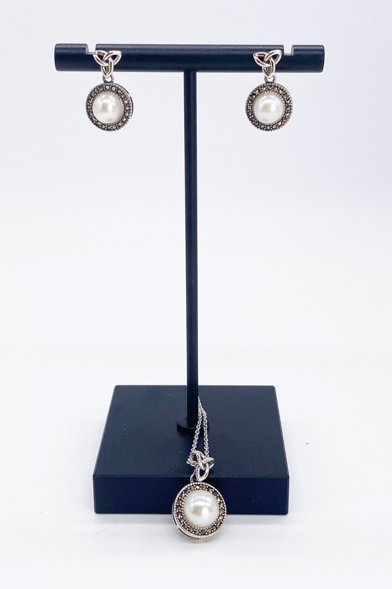 Trinity Pearl Marcasite Earrings and necklace on a black jewelry stand - L'Atelier Global