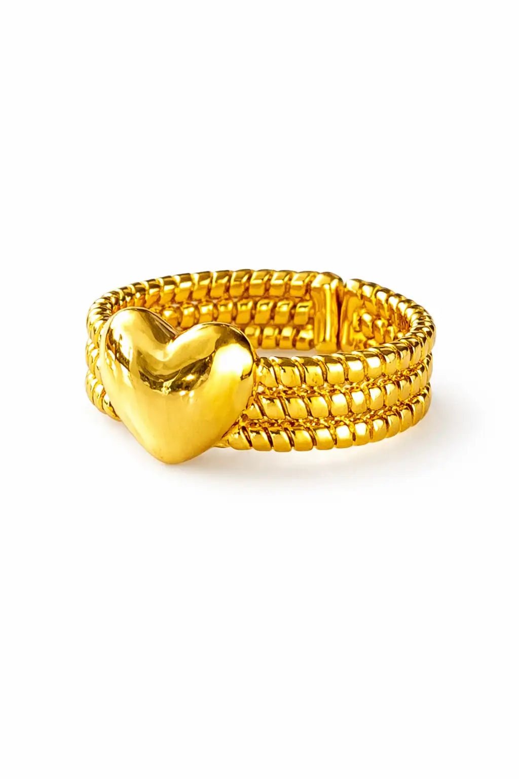 Gold heart-shaped ring on a white background