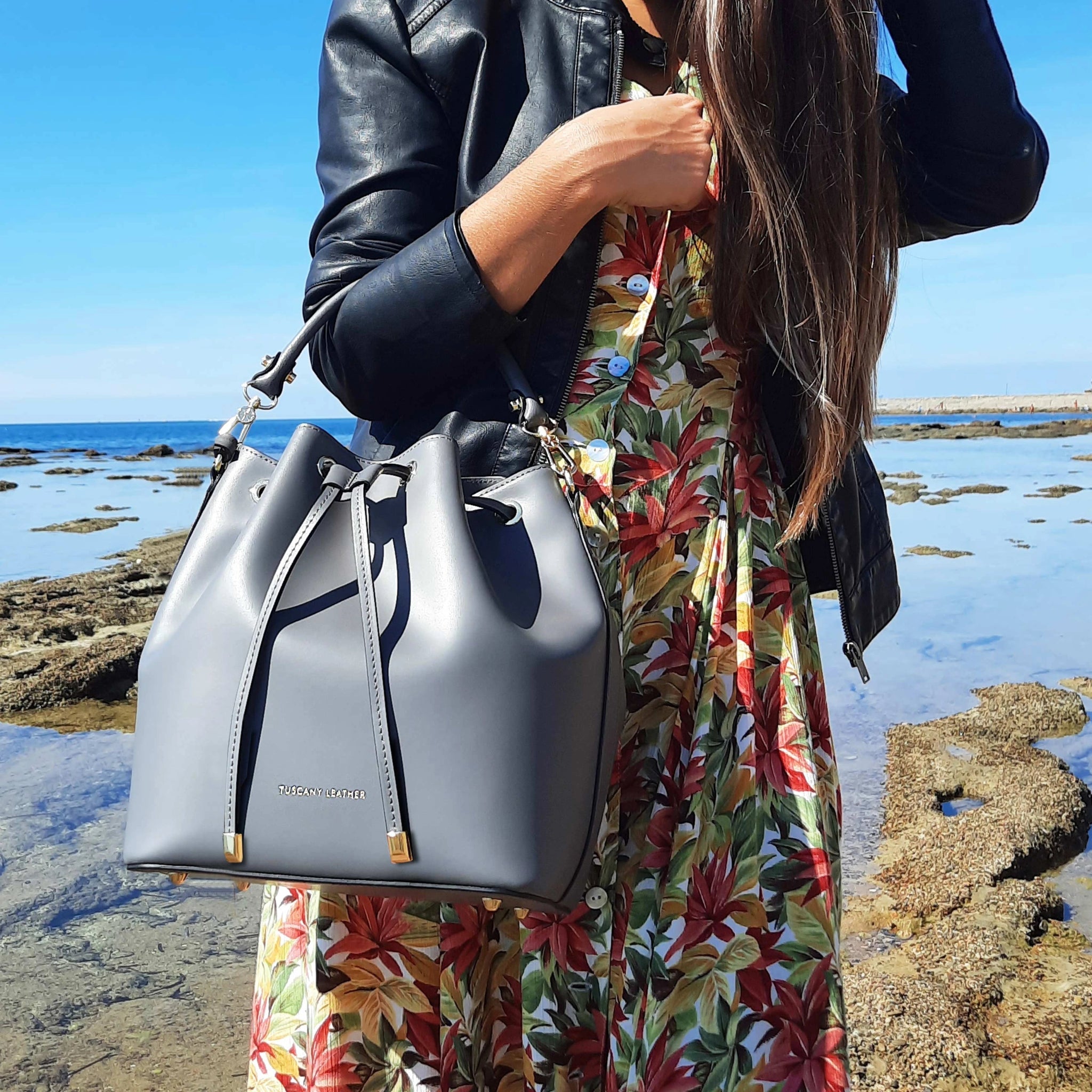 Vittoria Italian Leather Bucket Bag in Light Blue female model wearing a jean jacket and blue floral skirt - L'Atelier Global