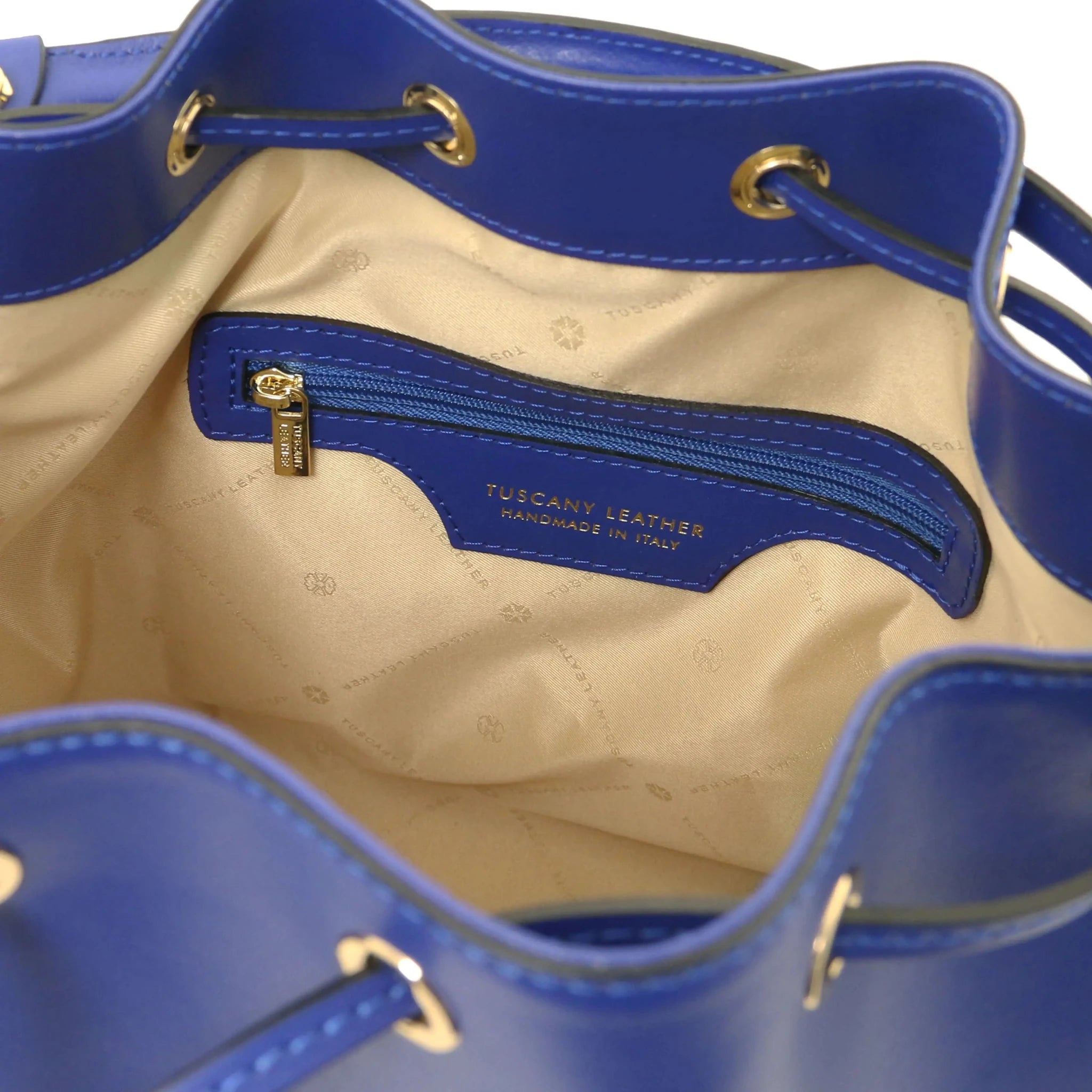 Interior one zip pocket view Vittoria Italian Leather Bucket Bag in blue with beige lining