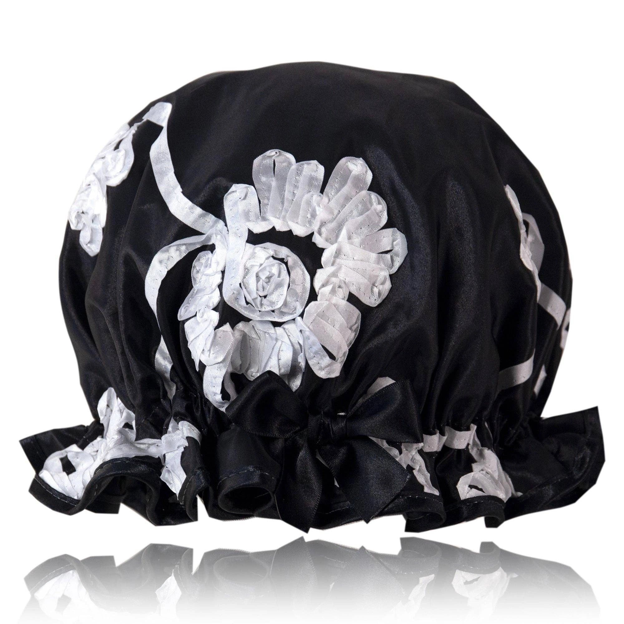 Black satin bonnet with white floral ribbon pattern on a white background