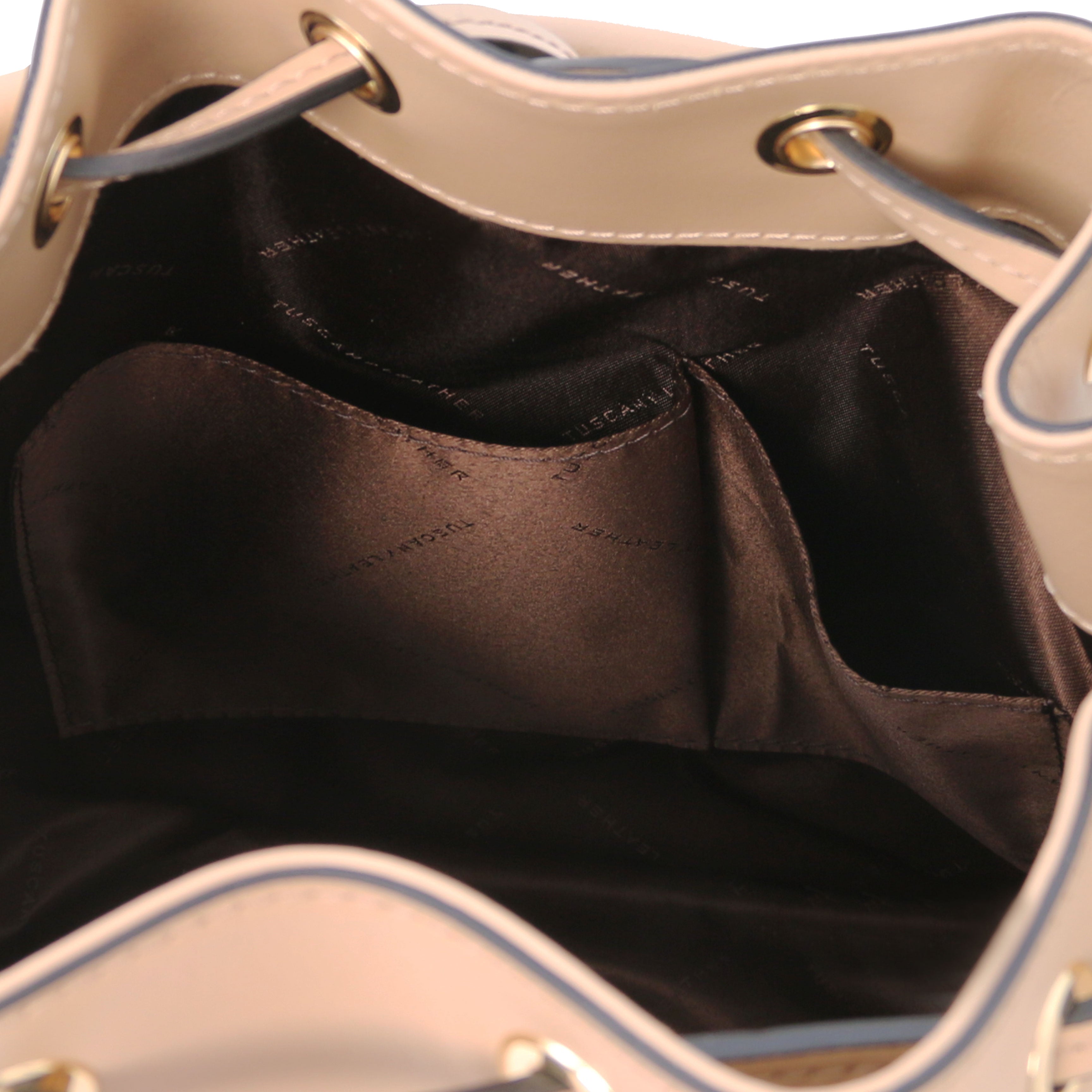 Interior open pocket view of Vittoria Leather Bucket Bag in champagne on a white background - L'Atelier Global