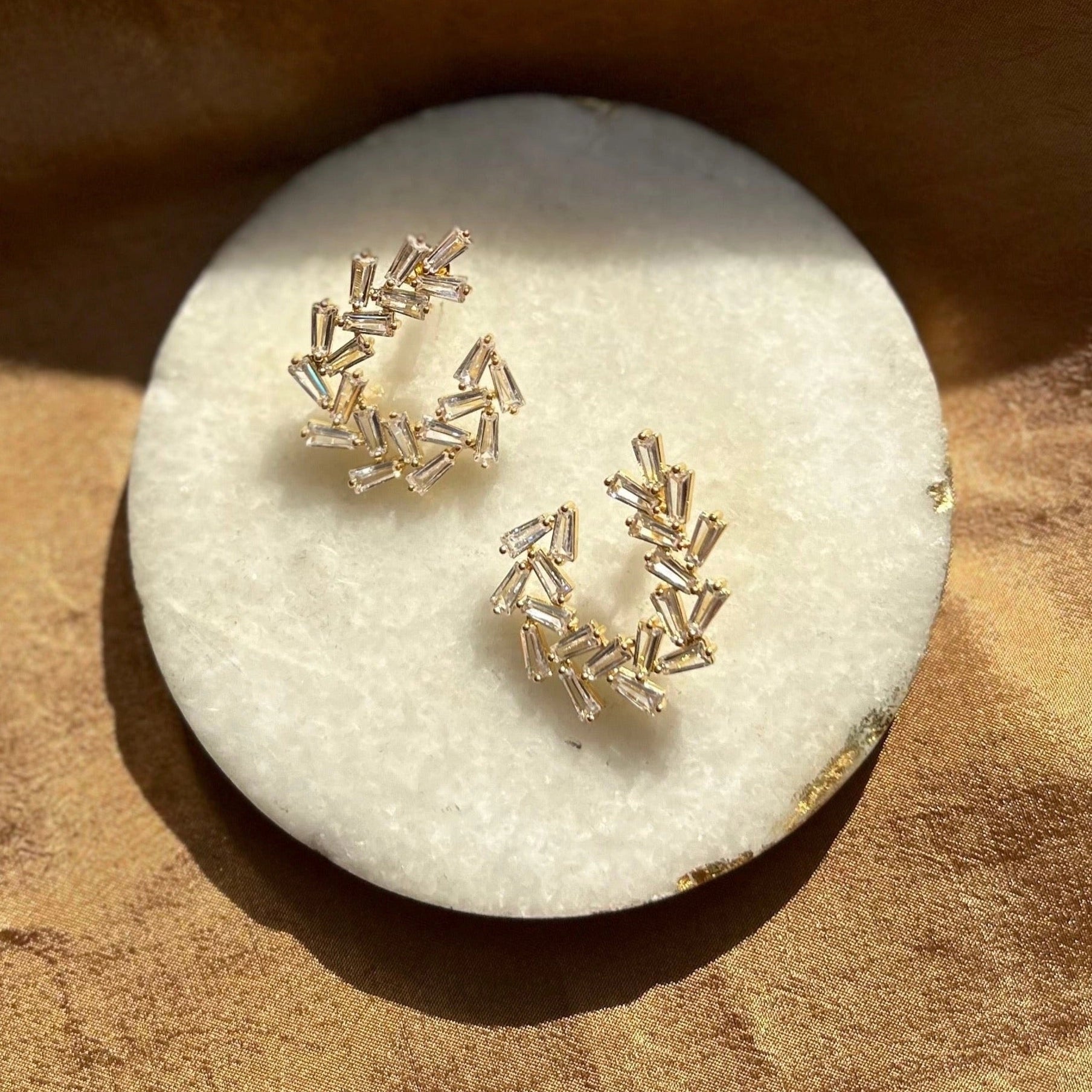 Arianna Sculpted Baguette CZ Earrings in gold on a shell background - L'Atelier Global