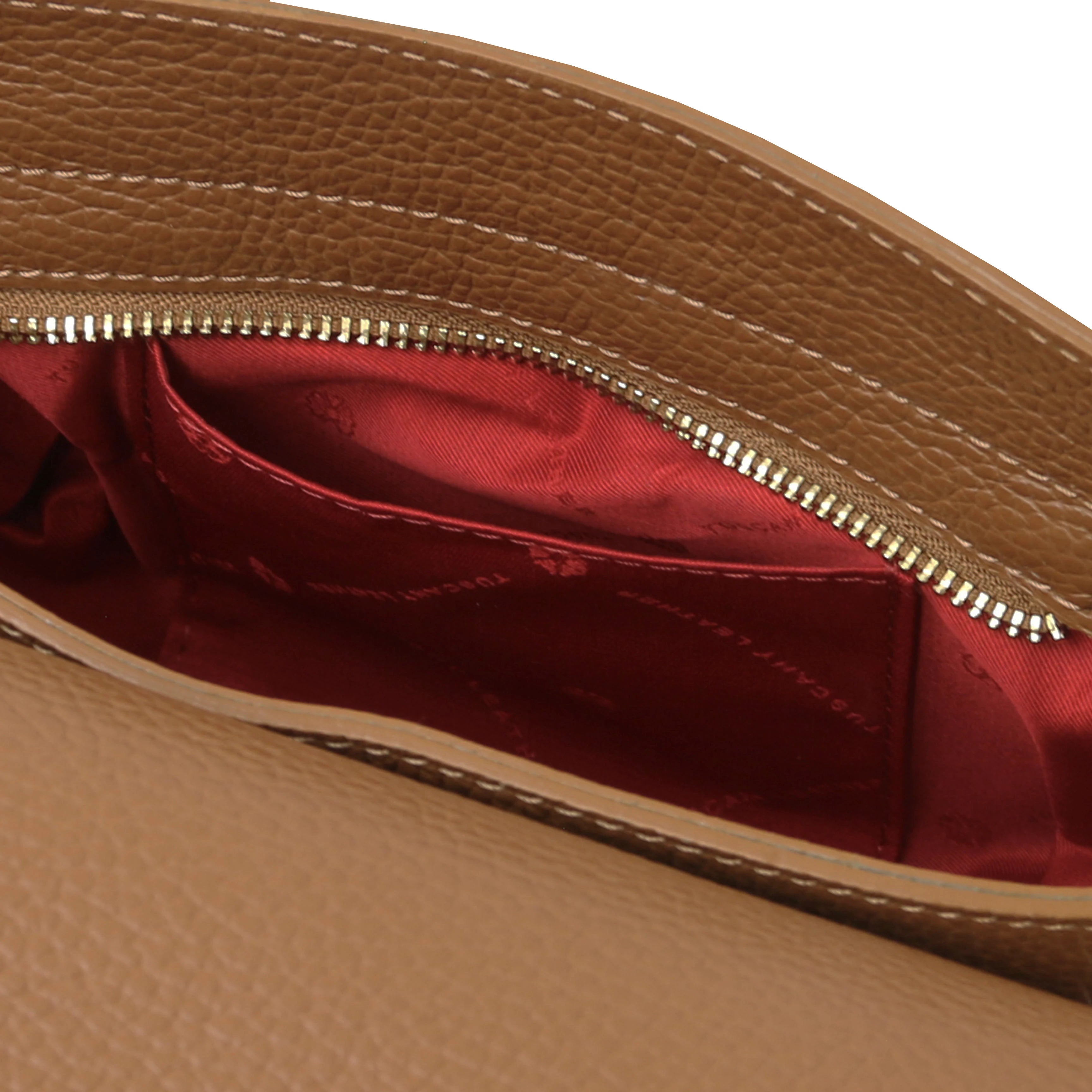 Interior open pockets view Astrea Leather Shoulder Bag in cognac on a white background