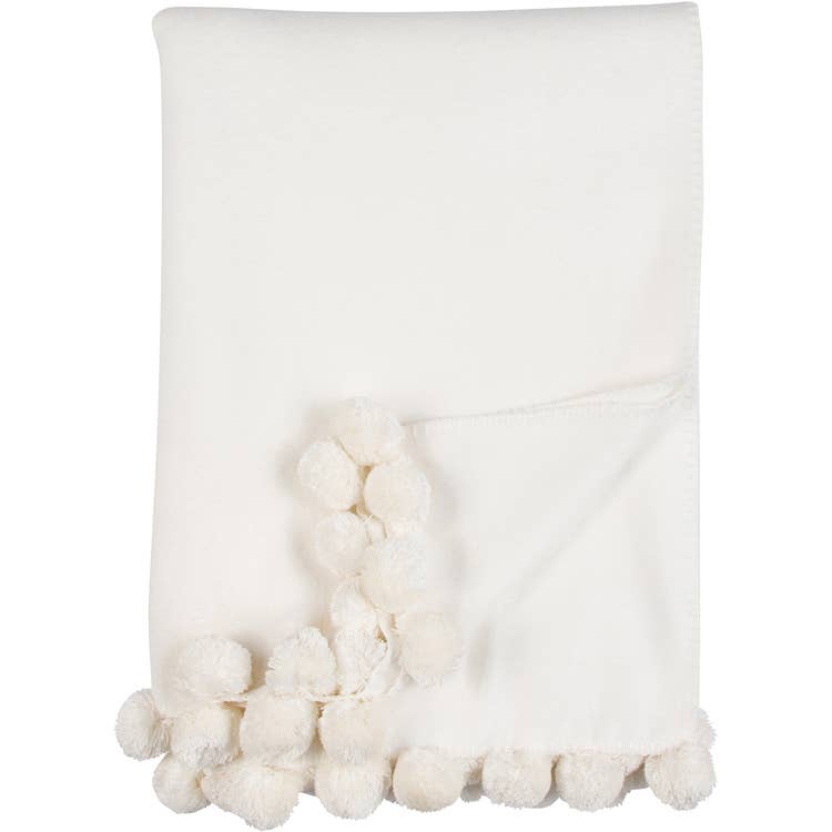 Bamboo Luxxe Pom Pom Throw in natural with natural pom poms folded on a white background - L'Atelier Global