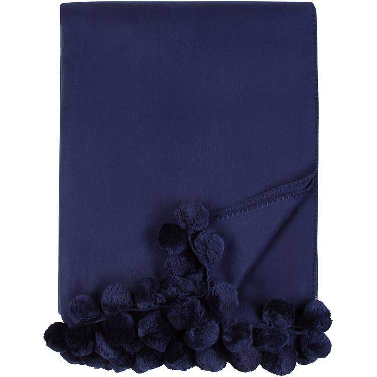 Bamboo Luxxe Pom Pom Throw in navy with navy pom poms folded on a white background - L'Atelier Global