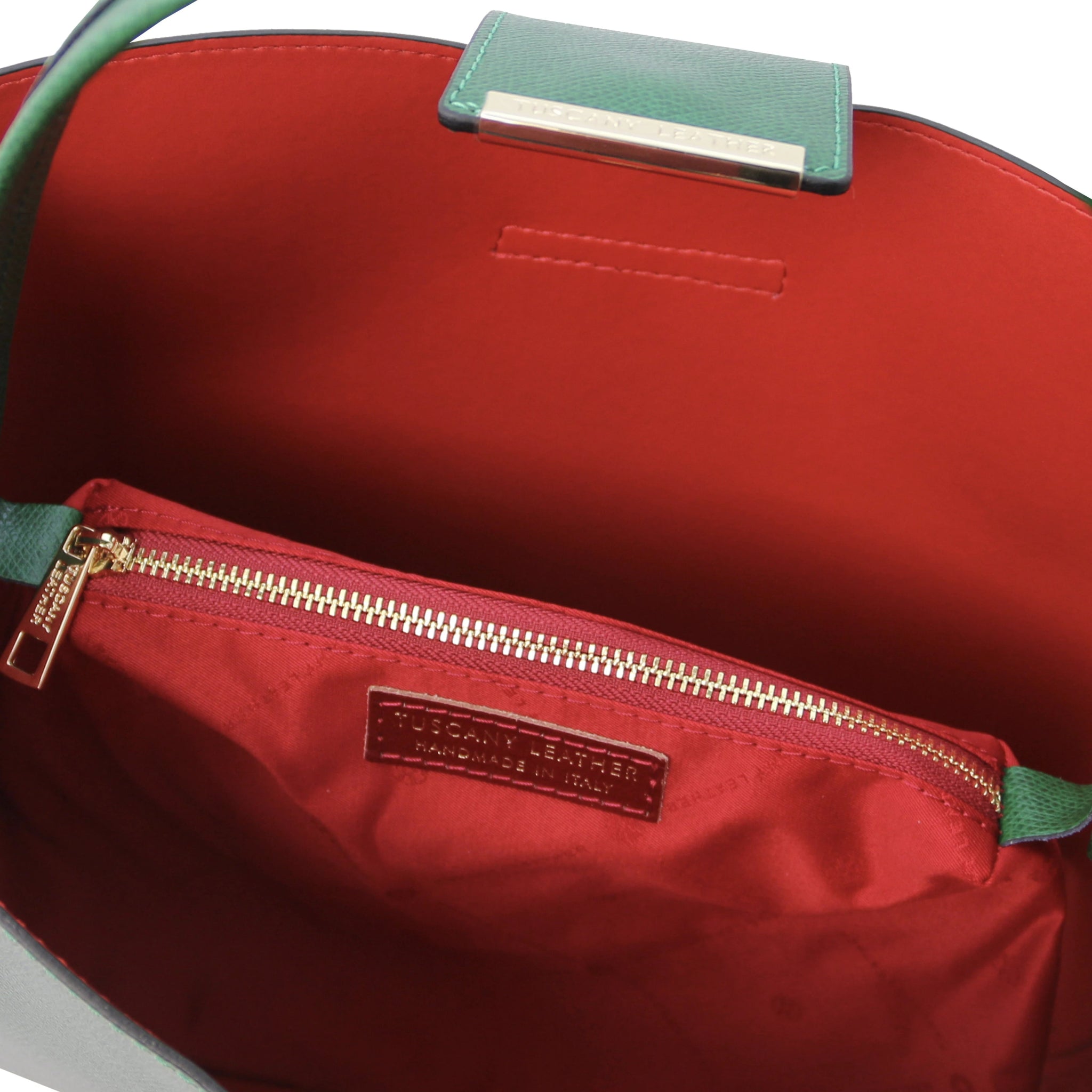 Exterior top view central zippered compartment and light tan lining of the Clio Italian Pebbled Leather Secchiello Bag in red