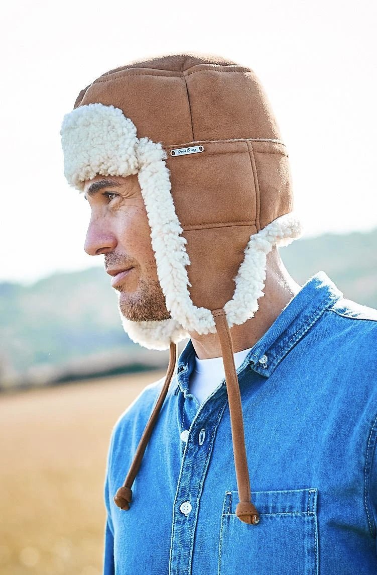 Kent Classic Sheepskin Trapper Hat in brandy on a male model wearing a denim shirt- L'Atelier Global