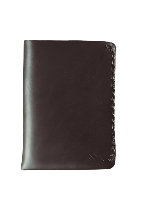 Minimalist Horween Wallet in black on a wood table - L'Atelier Global