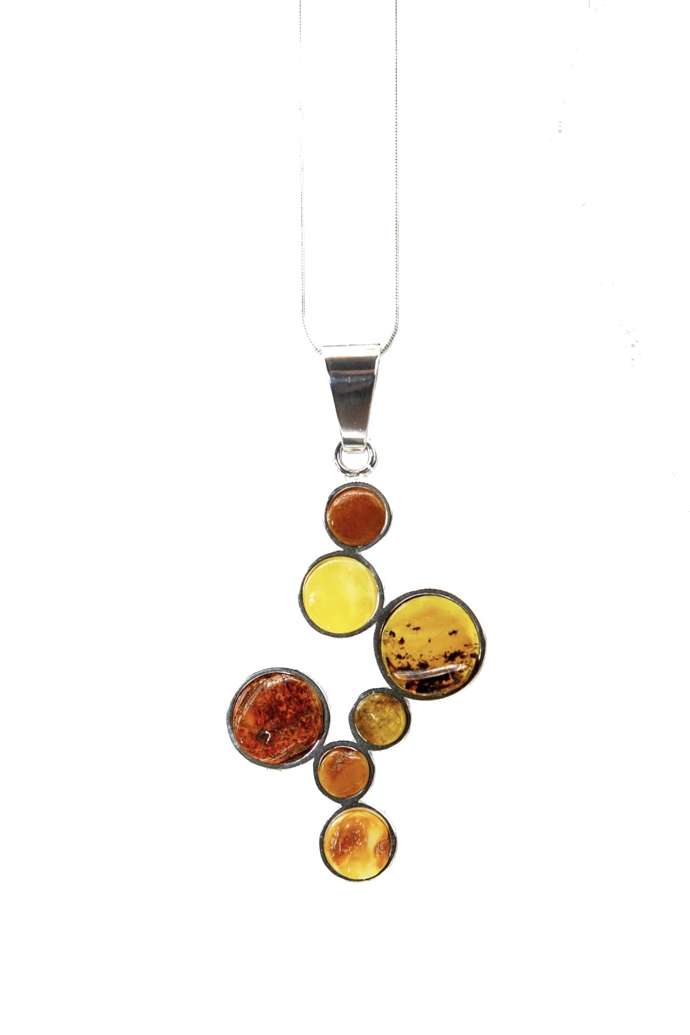 Multicolor Baltic Amber Stepping Stone Necklace hanging on a white background - L'Atelier Global
