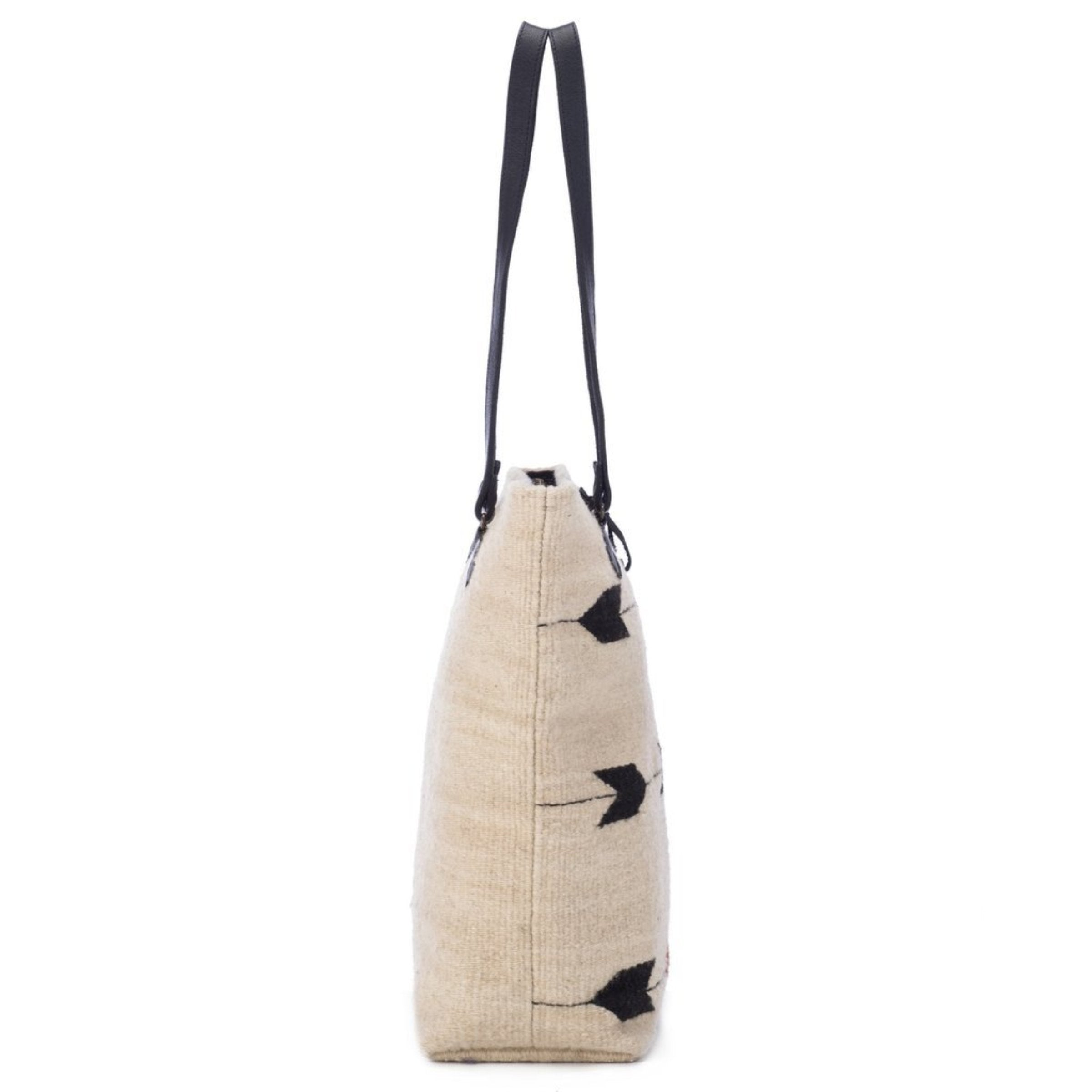 Obsidian Arrow Tote Bag is hanging on an all white background, side view - L'Atelier Global