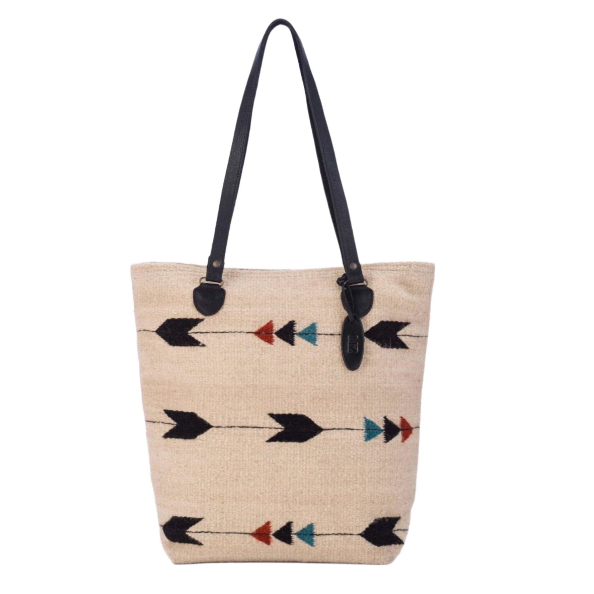 Obsidian Arrow Tote Bag is hanging on an all white background, front view - L'Atelier Global