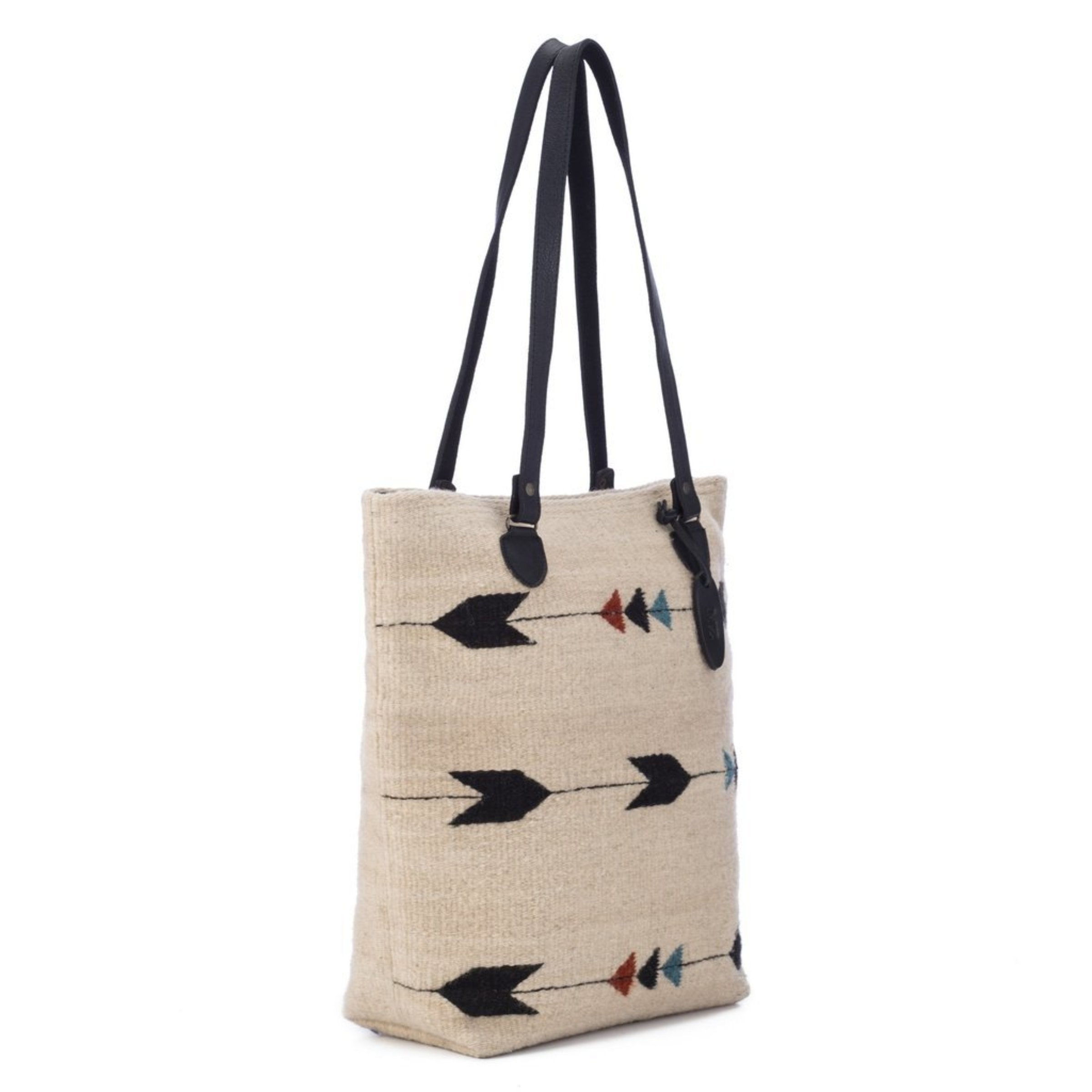 Obsidian Arrow Tote Bag is hanging on an all white background, front side view - L'Atelier Global