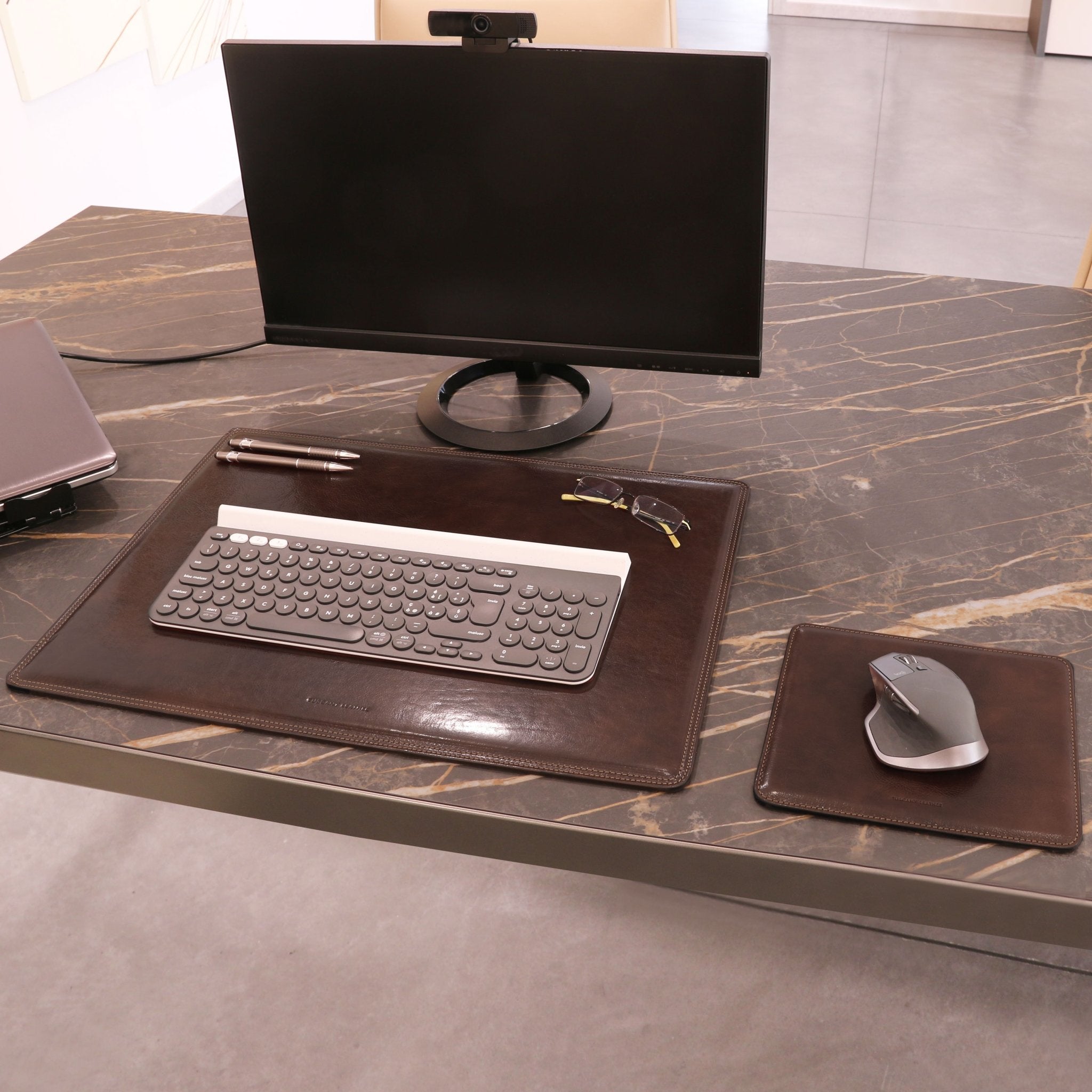 Office desk view of Office Set Italian Leather Desk Pad and Mouse Pad in dark brown on a white background - L'Atelier Global