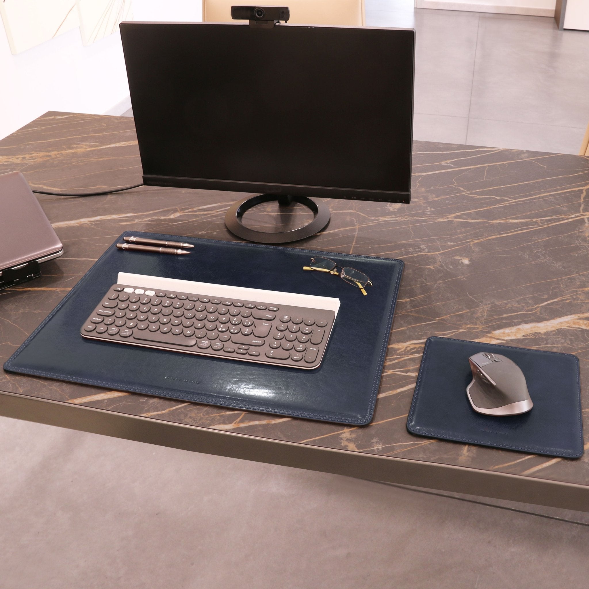 Office view if the Office Set Italian LeatherDesk Pad and Mouse Pad in dark blue on a white background - L'Atelier Global