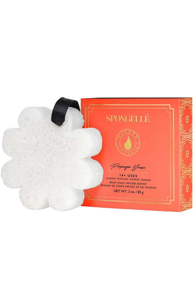 8-petal shaped Buffer in white with black hanging loop next to orange shipping box.