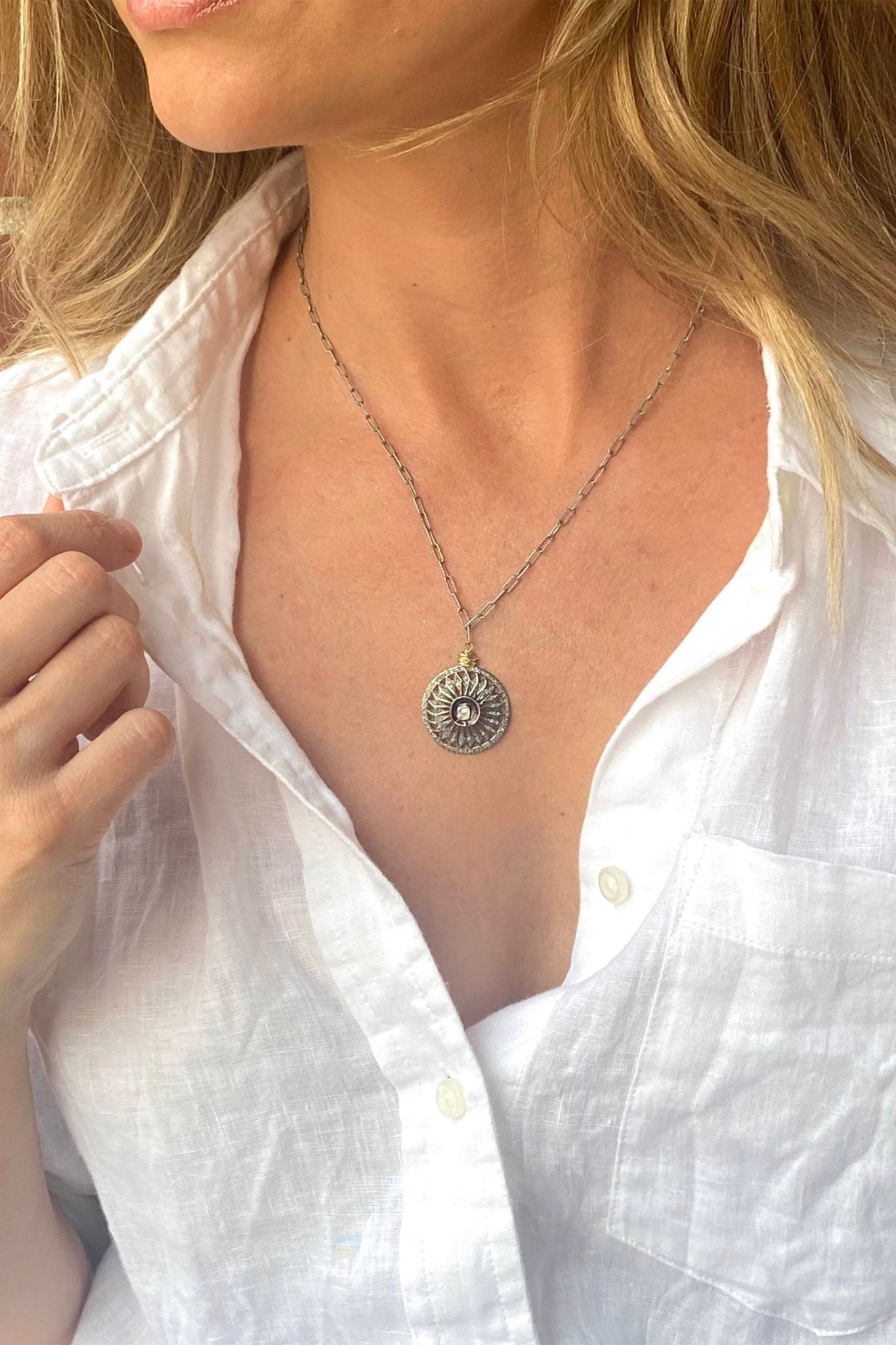 Rose Cut Diamond Coin Antique Silver Necklace on a model wearing a white cotton blouse - L'Atelier Global