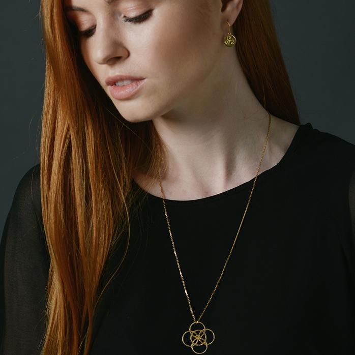 Irish Serenity Gold Necklace on model with red hair and wearing a black sweater  - L'Atelier Global