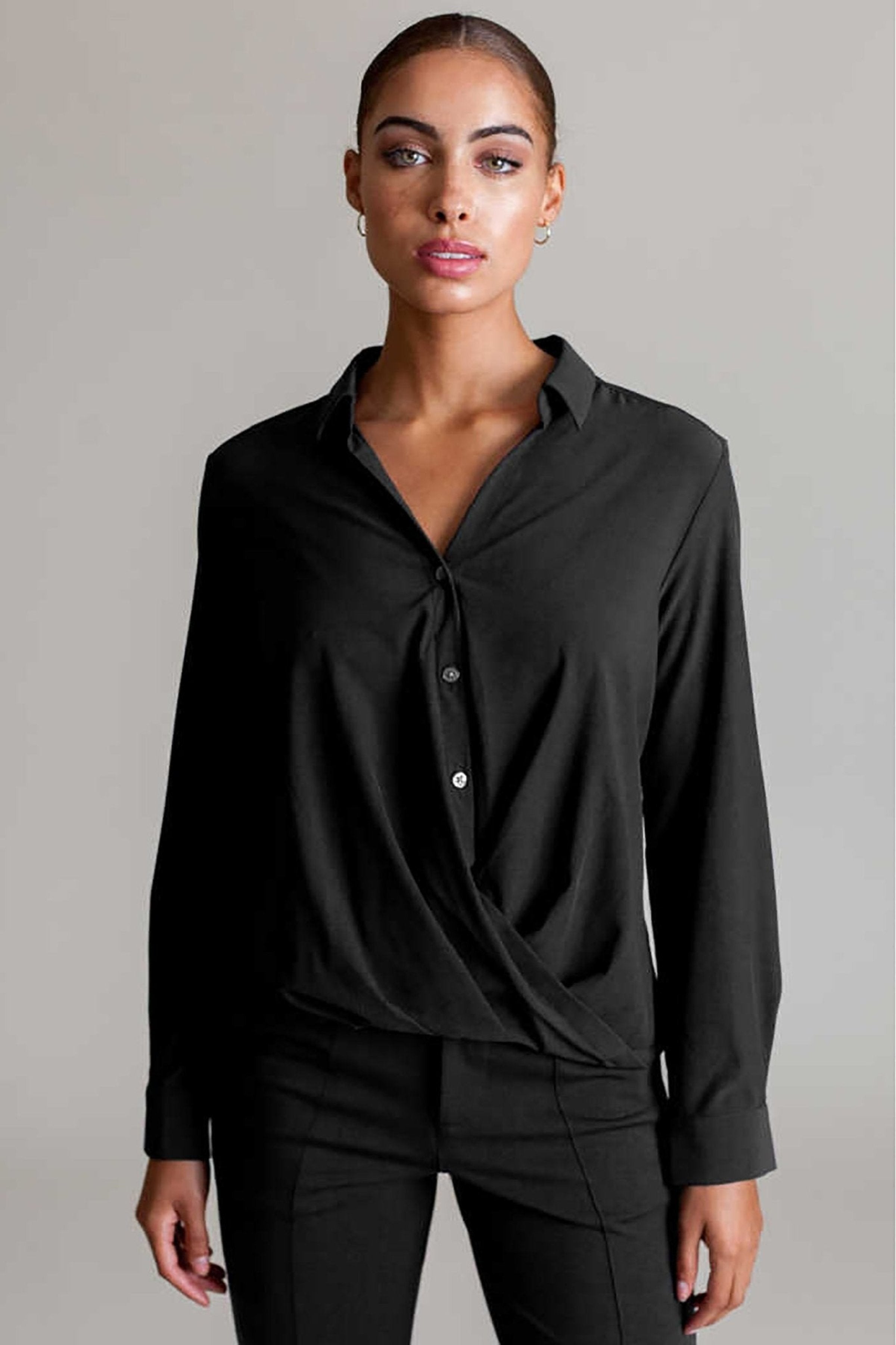 Front view of a female model wearing the Signature Barcelona Blouse in Black - L'Atelier Global