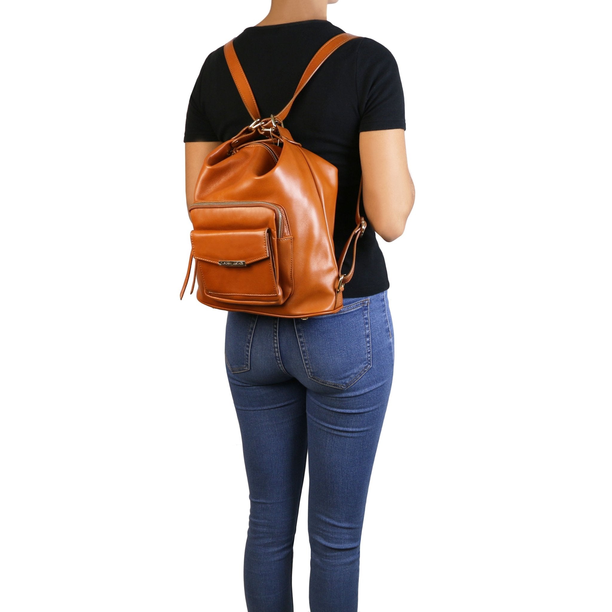 TL Bag Leather Convertible Bag in Cognac on model wearing black shirt and blue jeans- L'Atelier Global